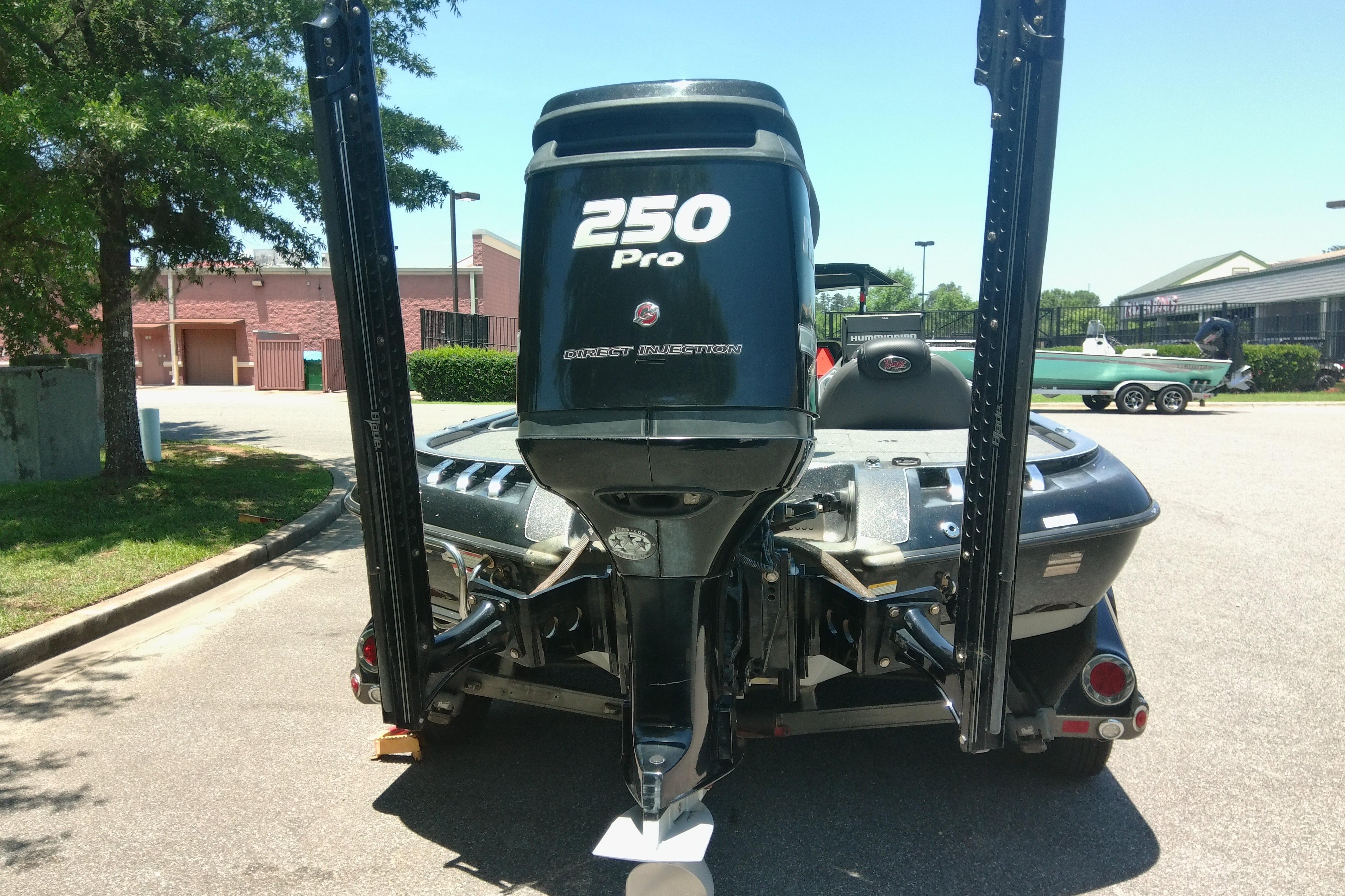 2012 Ranger Z520 boat with 250 Pro engine, parked outdoors.