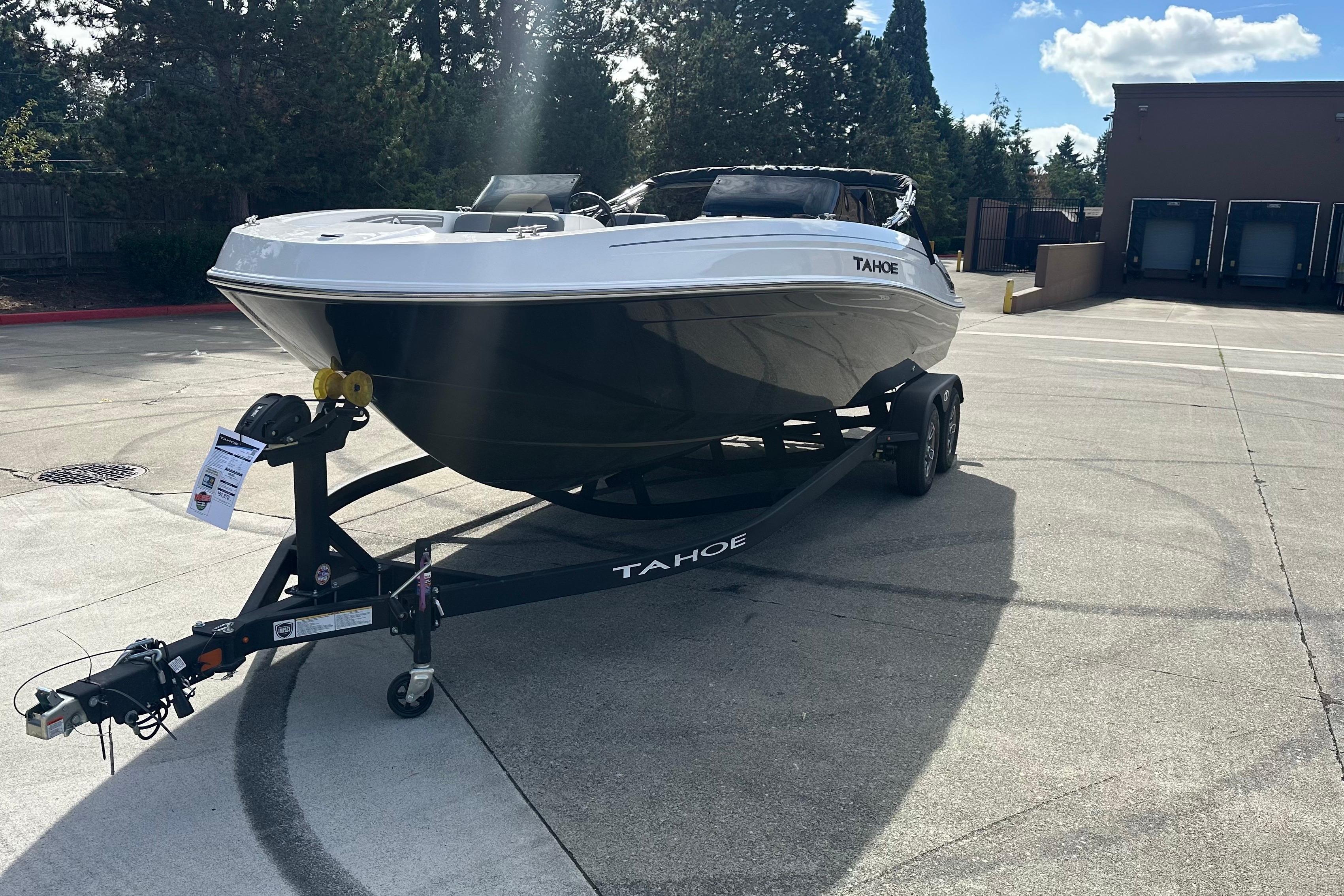 2026 Tahoe T21 boat on trailer in sunny outdoor setting.
