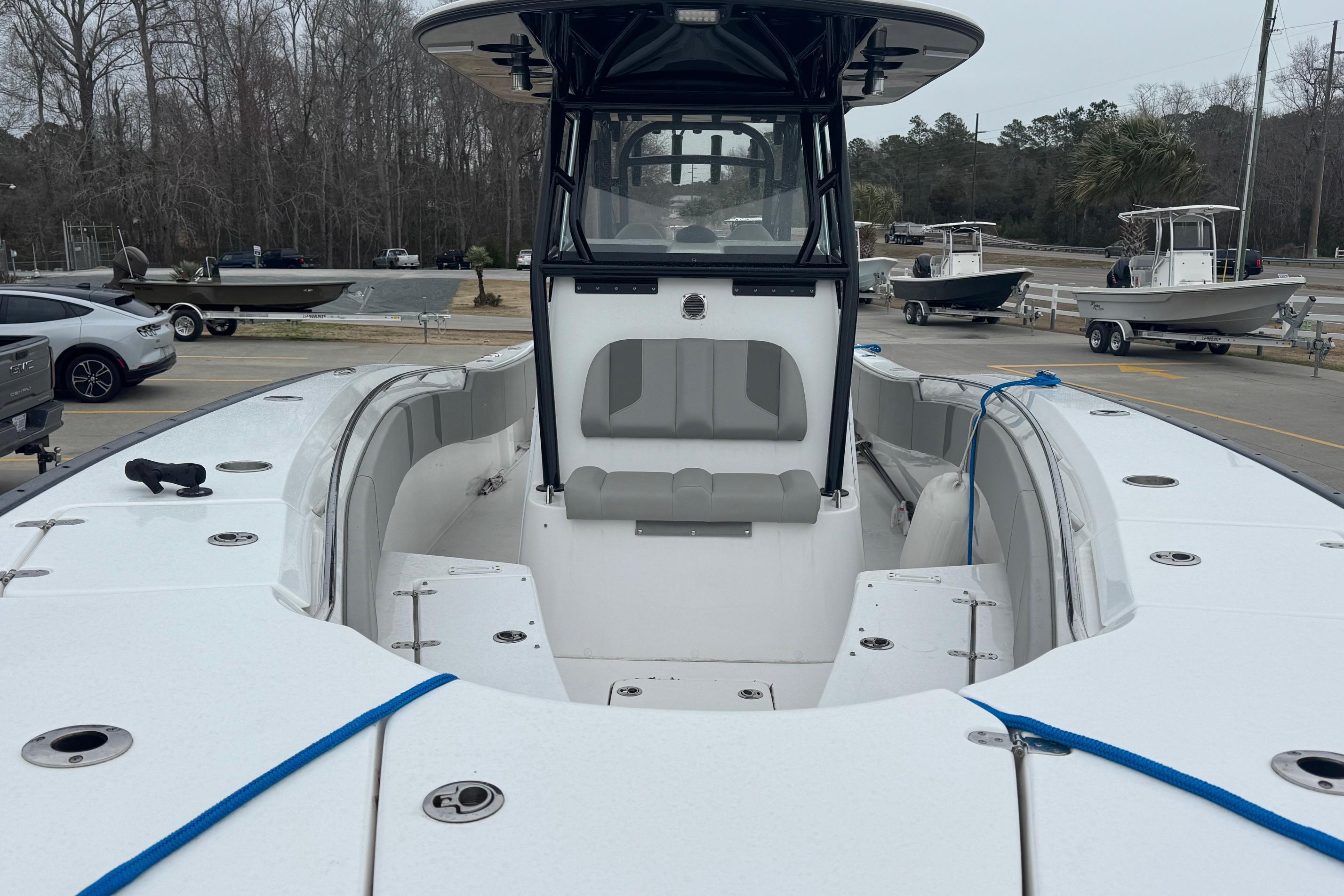 2024 Cape Horn 32 XS boat with spacious seating and modern design at a marina.