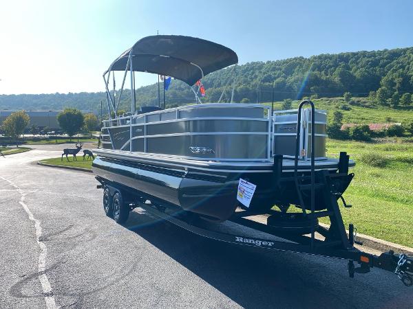 2024 Ranger Reata 223C pontoon boat on trailer, parked outdoors.
