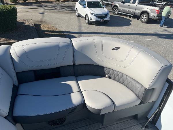 2024 Starcraft SLS3 boat with luxurious seating in a parking lot.