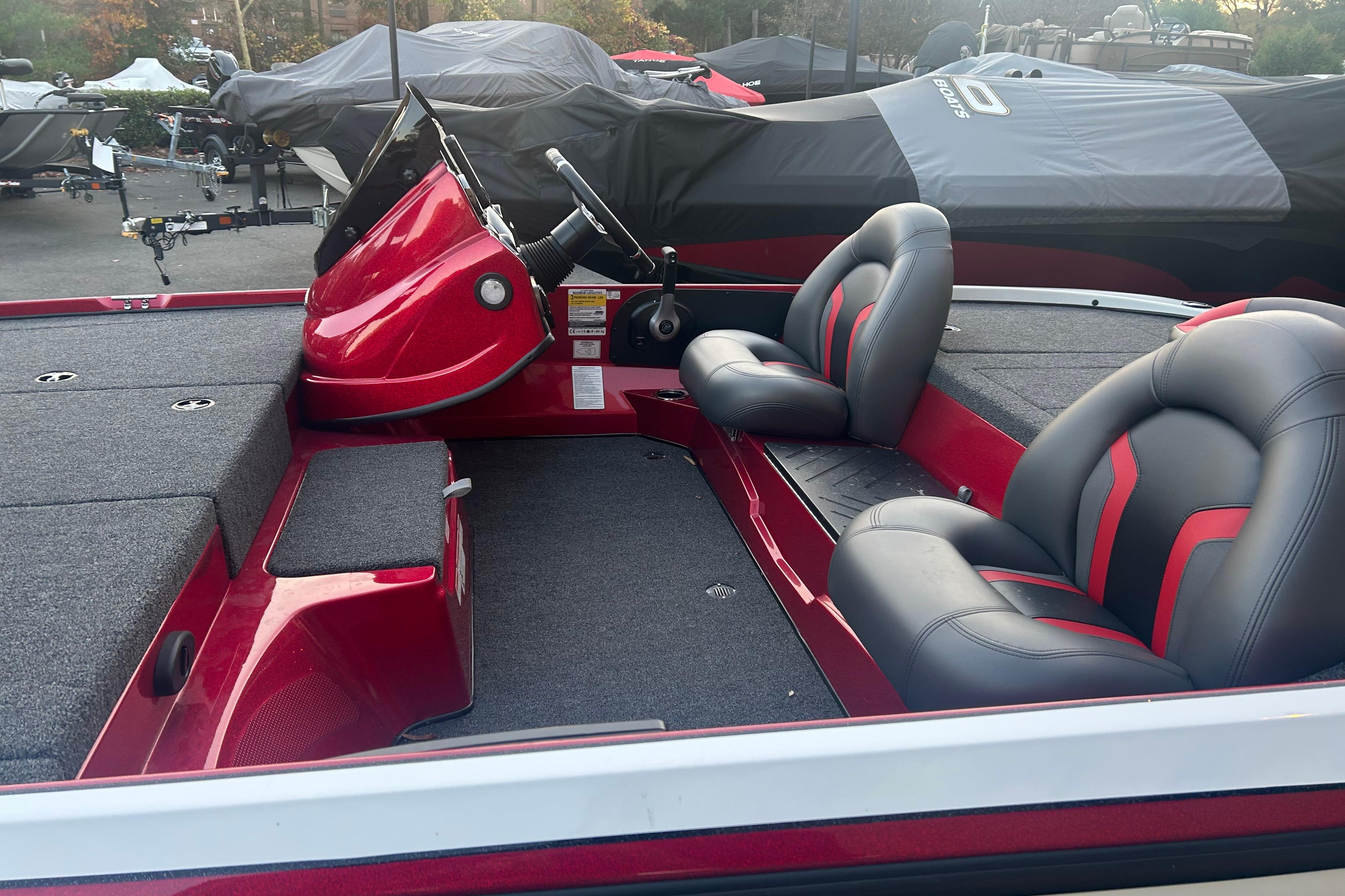 Red and gray interior of 2026 Nitro Z17 boat with dual seats and steering console.