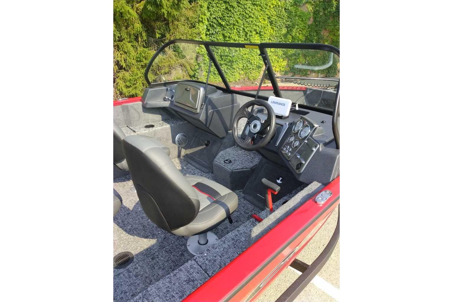 2026 Tracker Pro Guide V-175 WT boat interior with steering wheel and control panel.