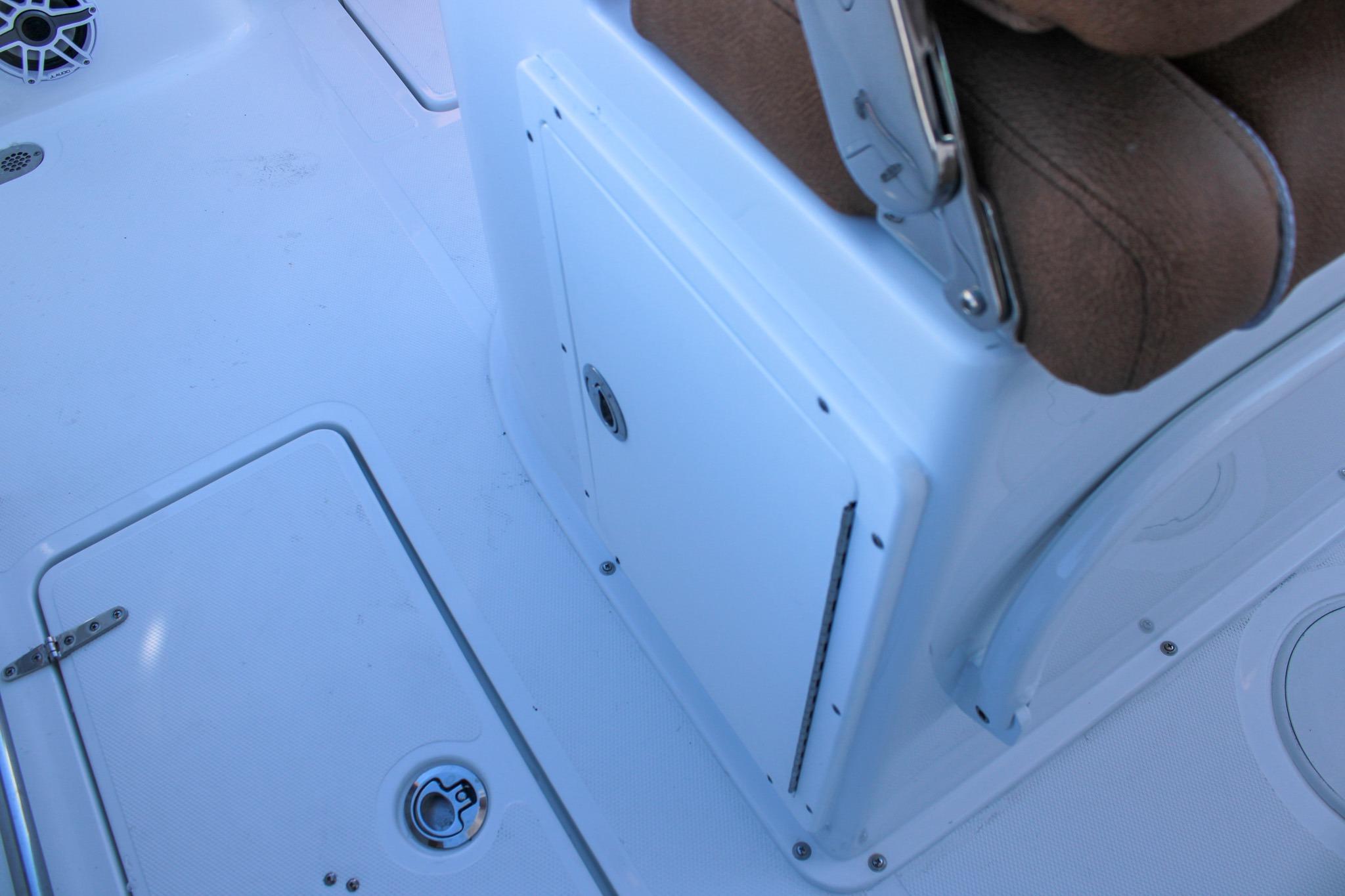 Interior view of 2026 Sea Hunt Gamefish 25 boat, featuring seating and storage compartments.
