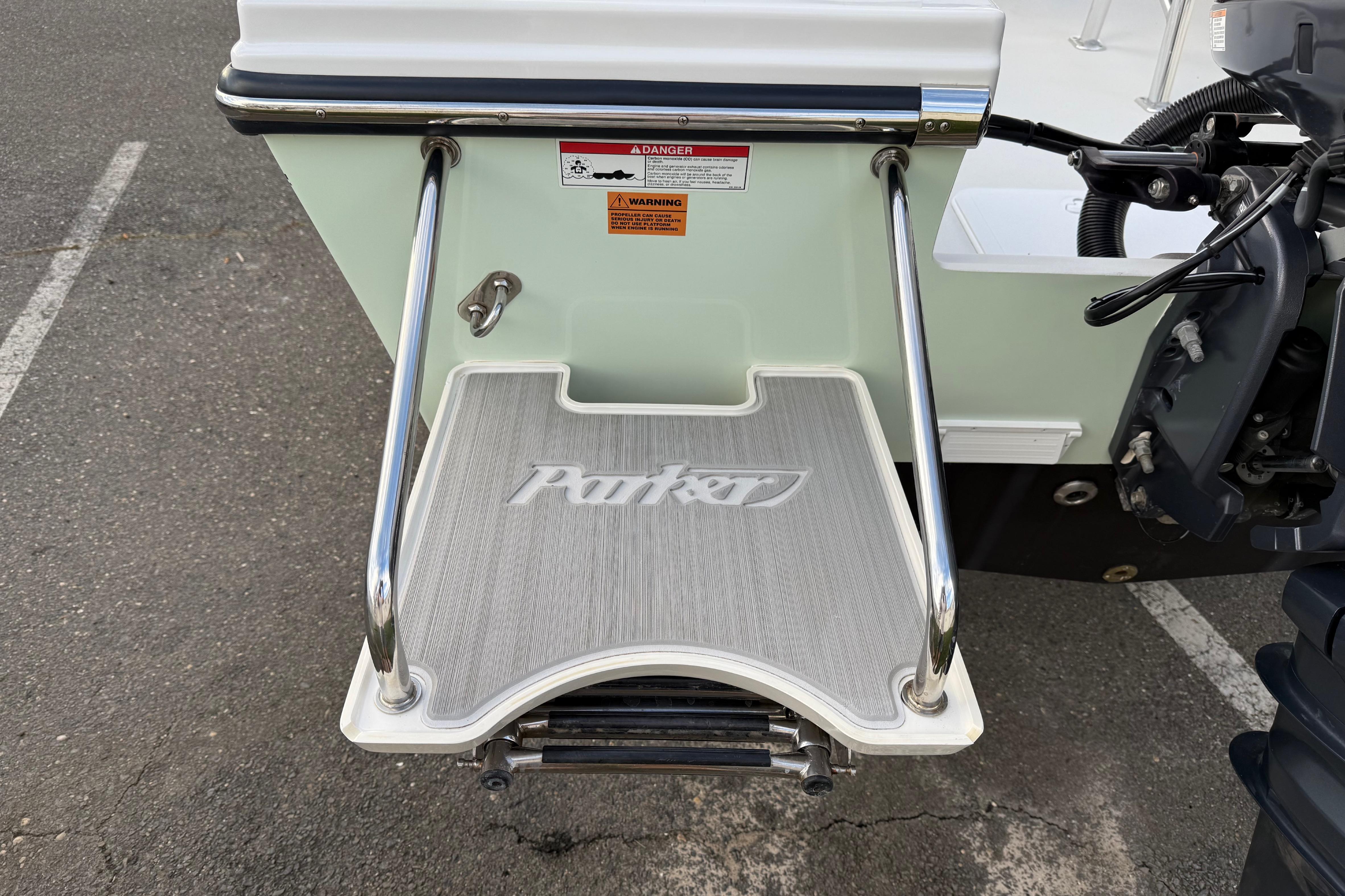 2024 Parker 1801 Center Console boat swim platform with safety railings and logo.