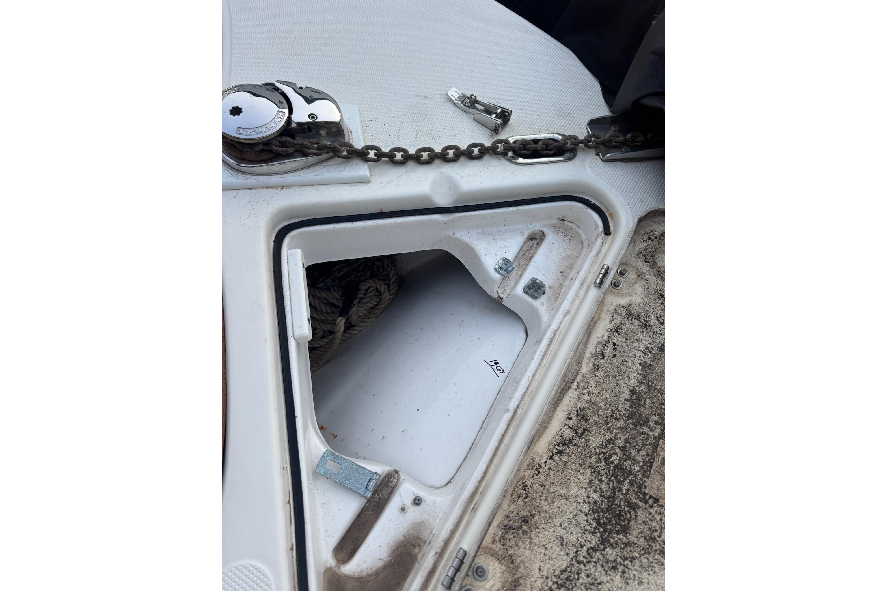 Anchor locker of a 2013 Sea Fox 246 Commander boat with chain and rope.