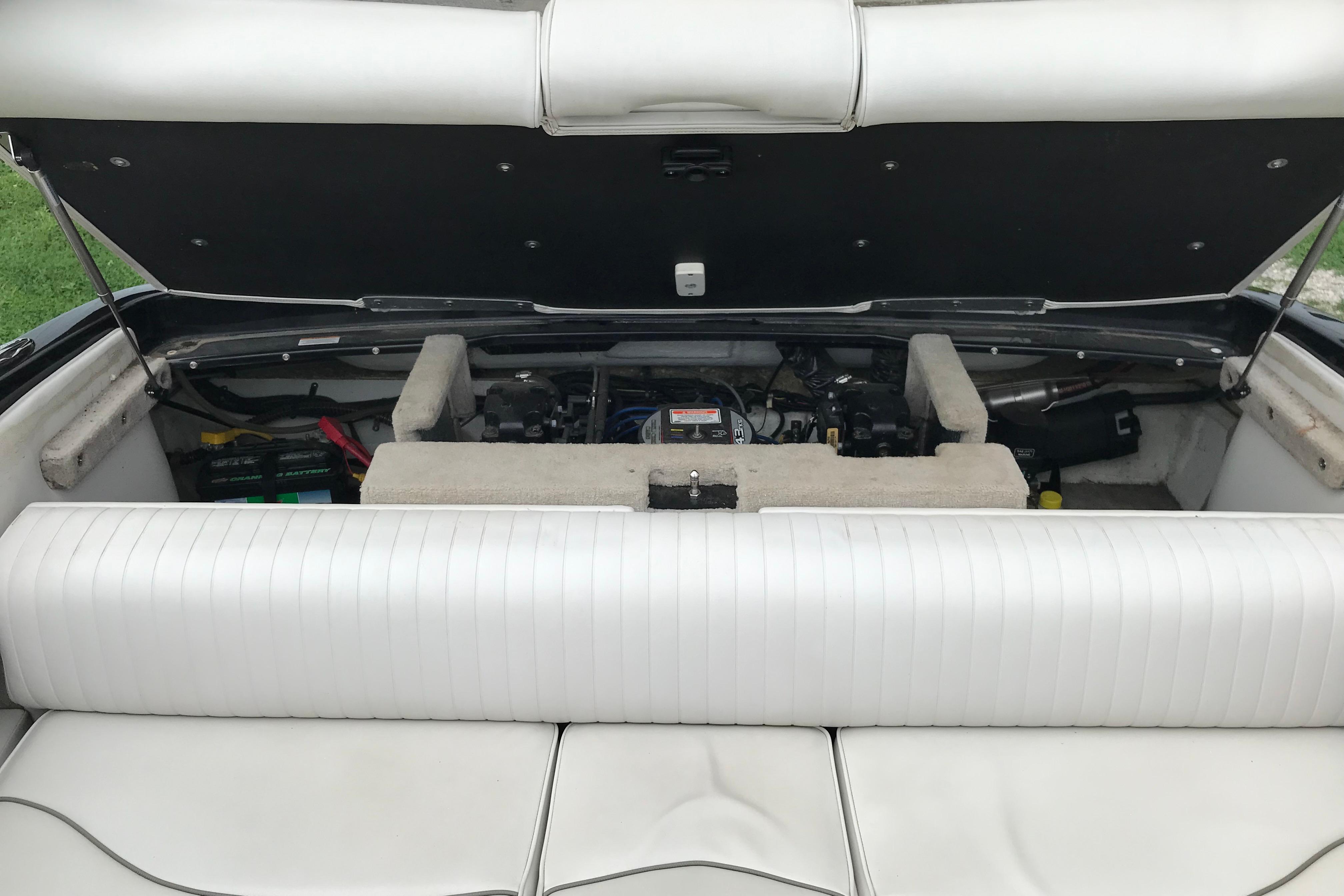 2015 Crownline 18 SS boat engine compartment with open cover, showcasing interior components.
