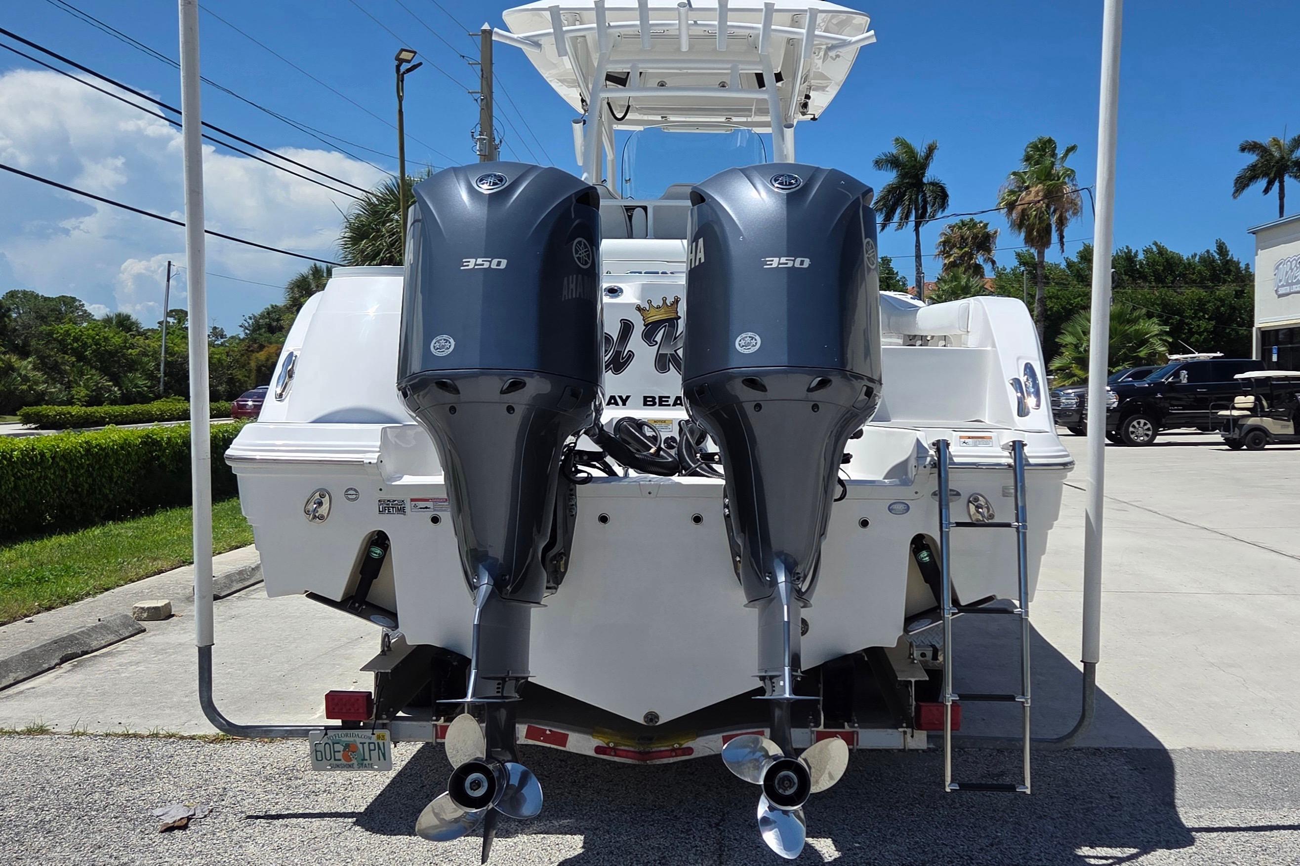 2021 Sea Fox 328 Commander with dual Yamaha 350 engines, parked outdoors.