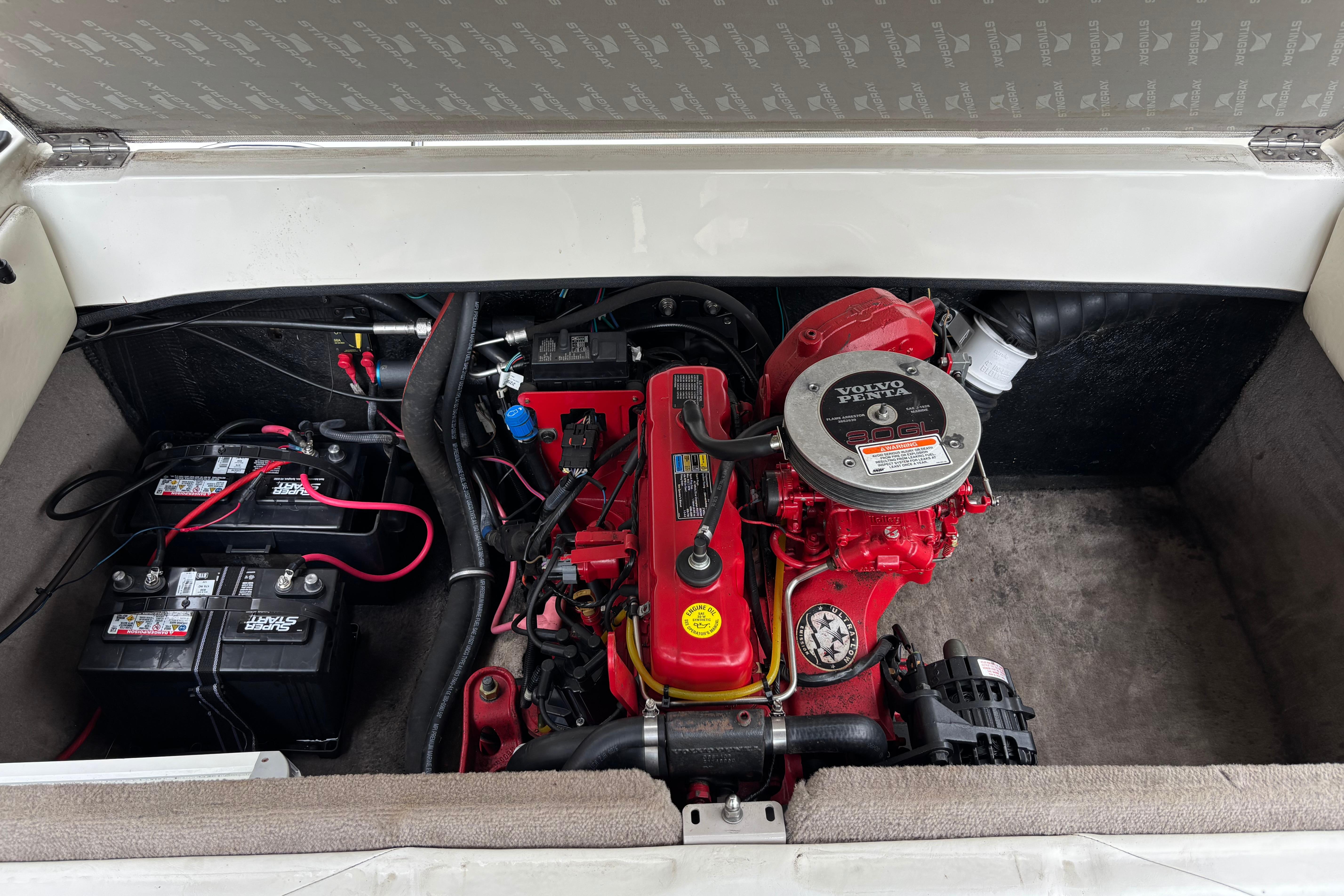 2007 Stingray 180 RX engine compartment with Volvo Penta engine and dual batteries.
