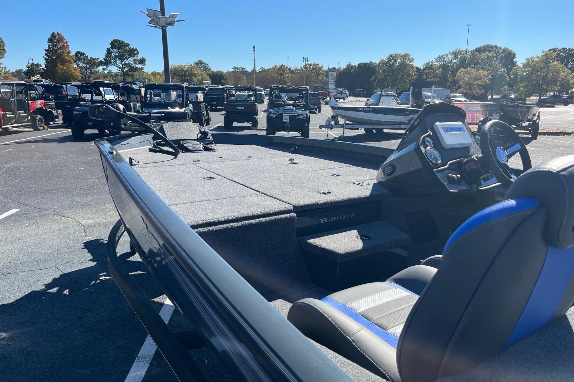 2025 Ranger RT188P boat in a parking lot, showcasing interior and control panel.
