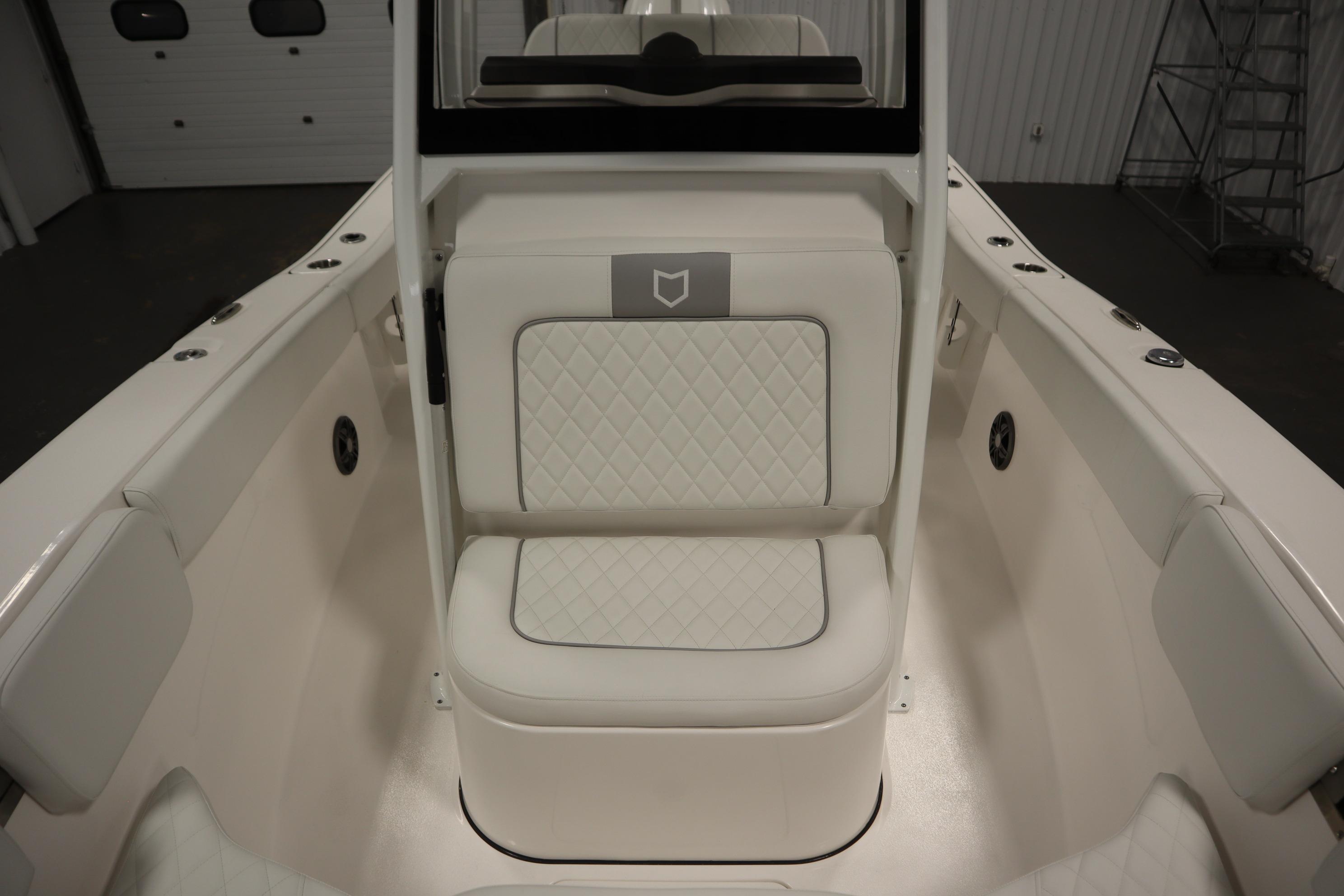 2026 Sea Fox 228 Commander boat interior with white cushioned seating and sleek design.
