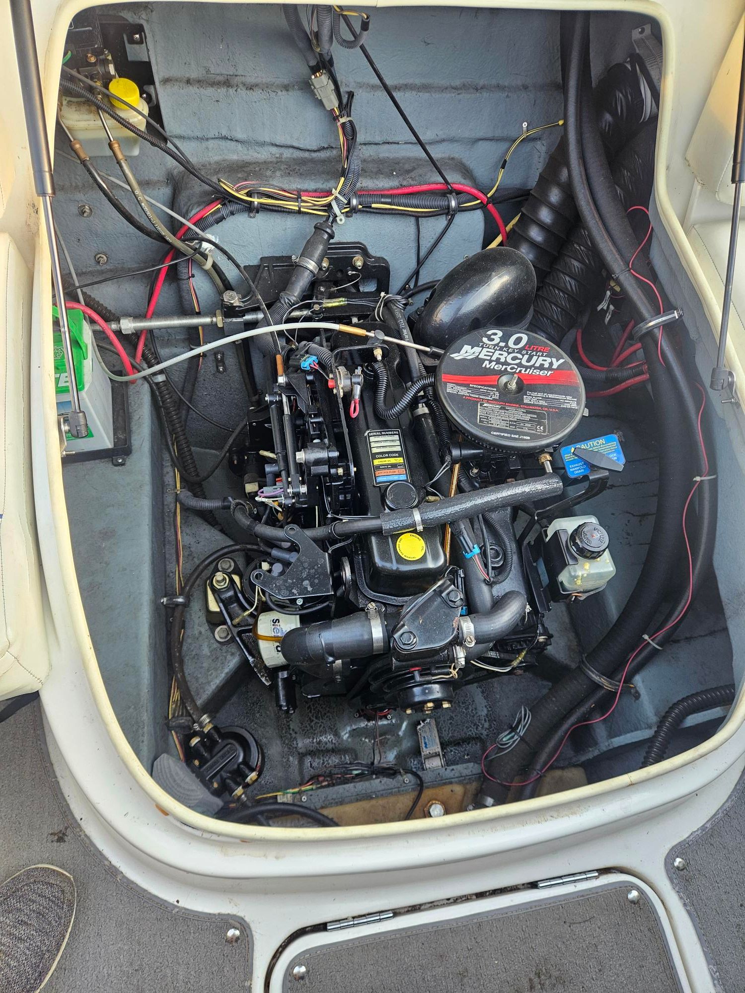 Engine compartment of 2006 Bayliner Cuddy Cab with 3.0L Mercury engine.