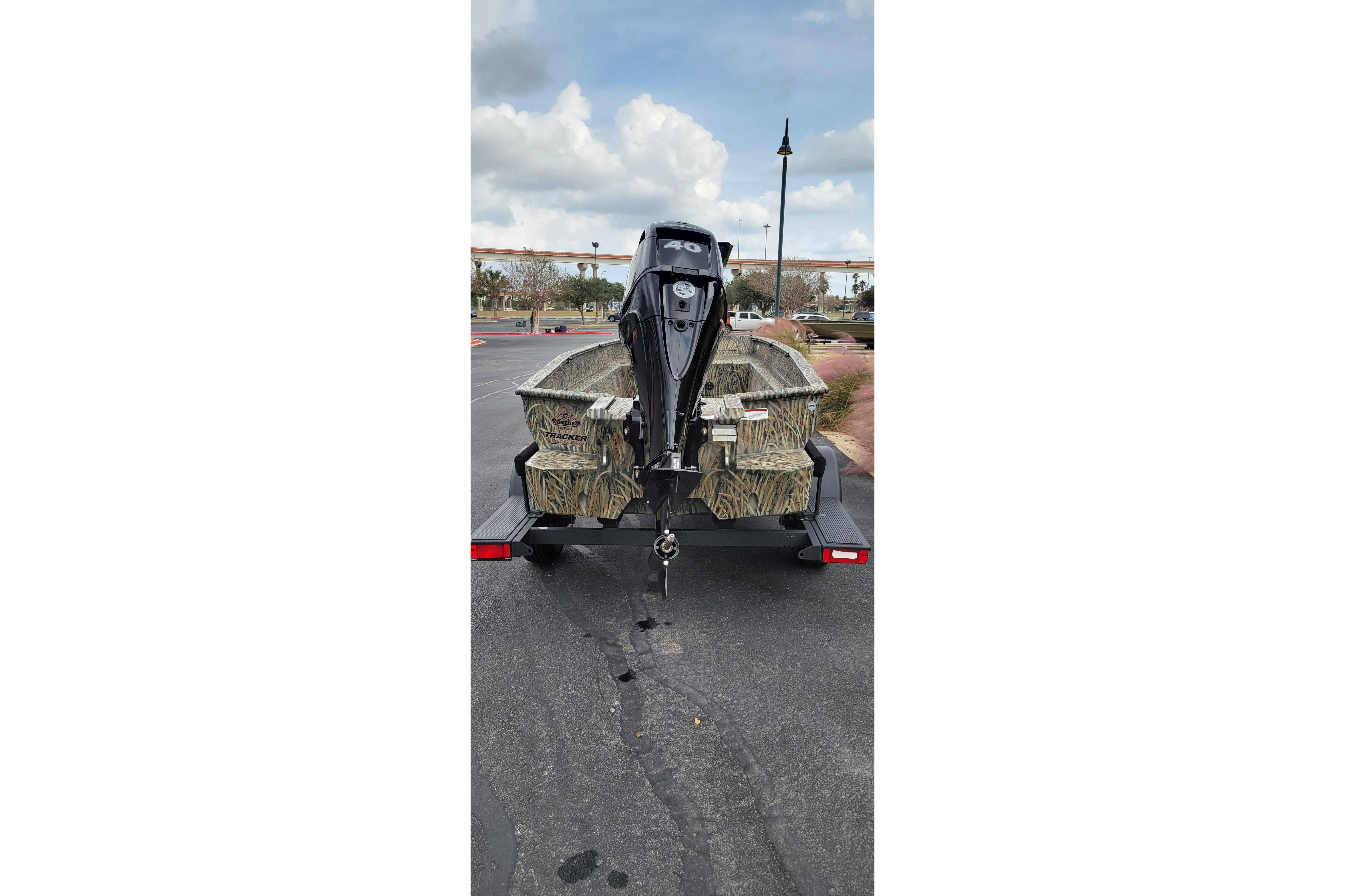 2025 Tracker Grizzly 1650 T Prairie Wings Edition boat on trailer, rear view.