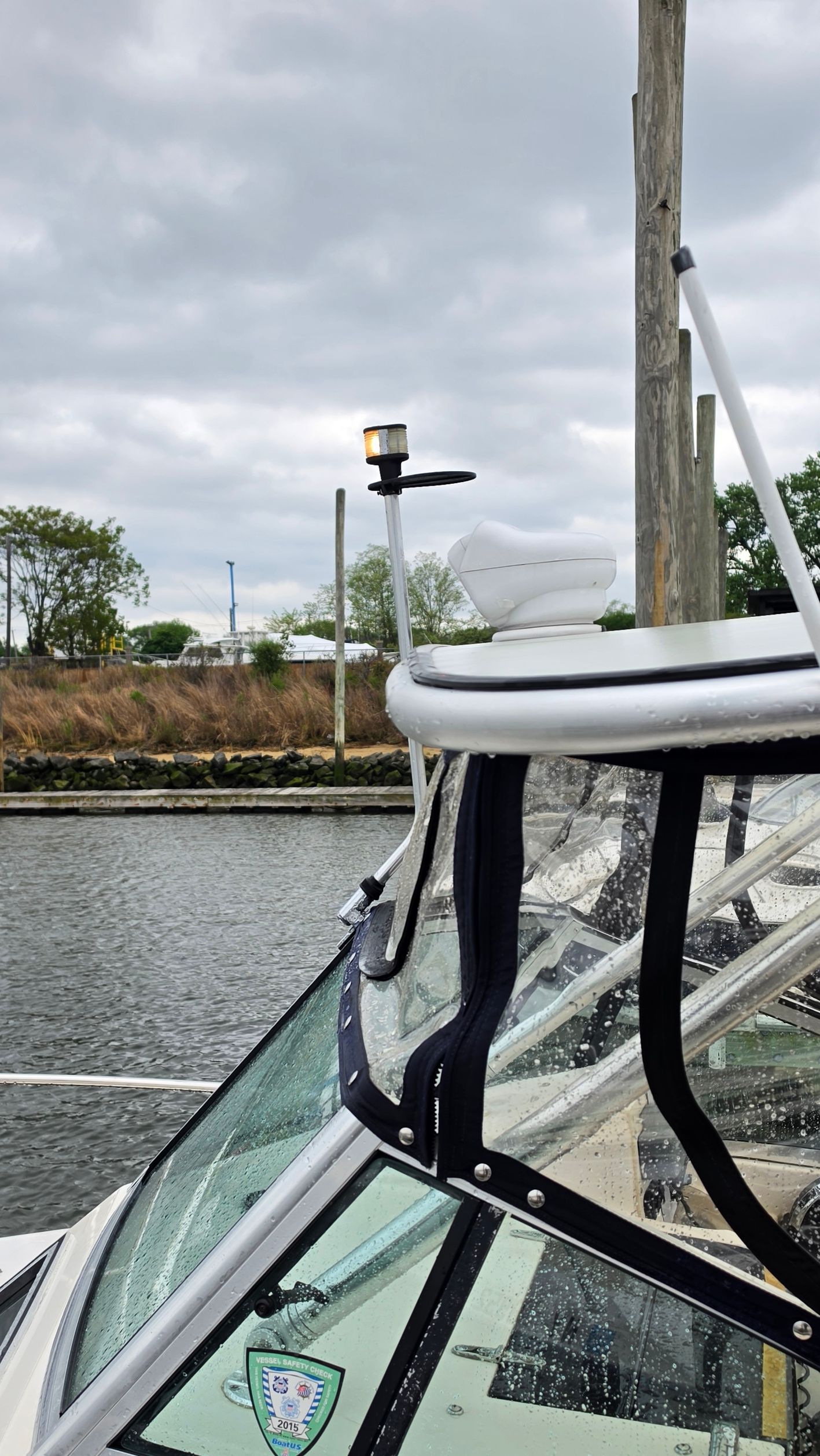 A 1993 Grady-White Seafarer is docked. It's cloudy and the water is calm.