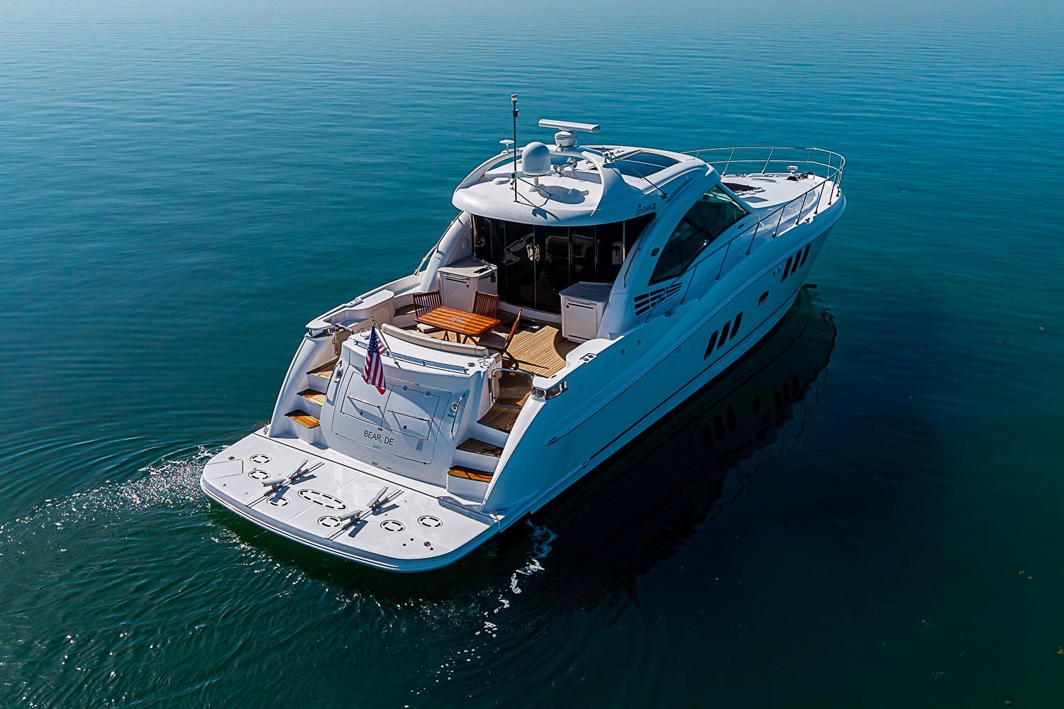 2008 Sea Ray 60 Sundancer yacht cruising on calm blue waters.