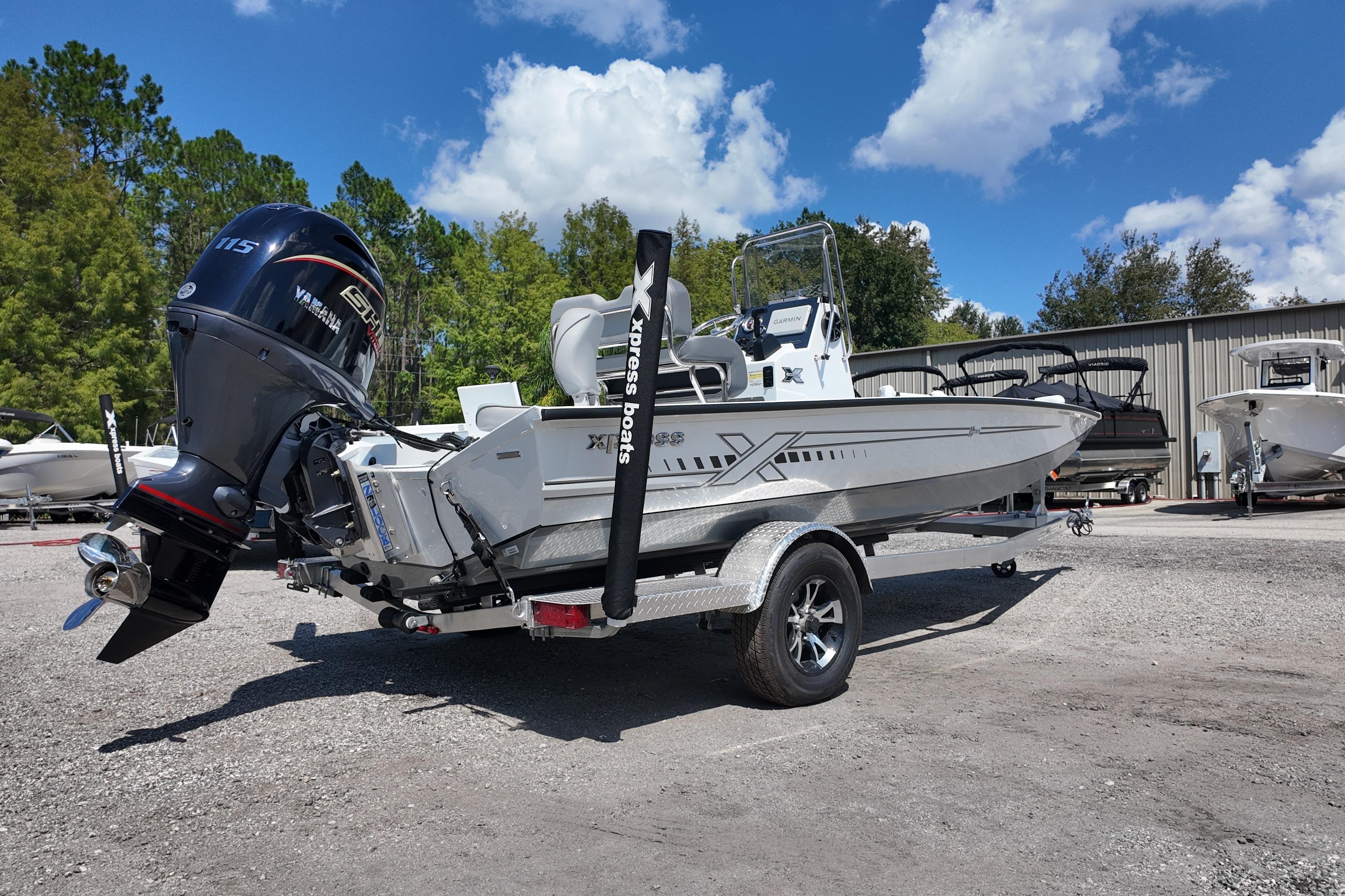 2026 Xpress H20 boat with Yamaha motor on trailer, parked outdoors.