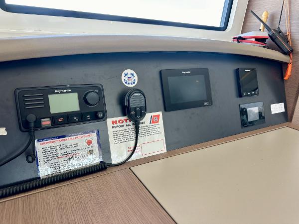 Control panel of a 2021 Bali 4.8 yacht with navigation and communication equipment.