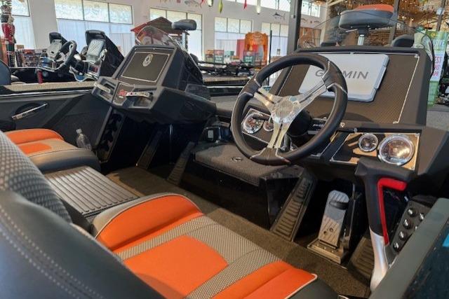 2025 Ranger Z518 Cup-Equipped boat interior with modern dashboard and orange-accented seats.