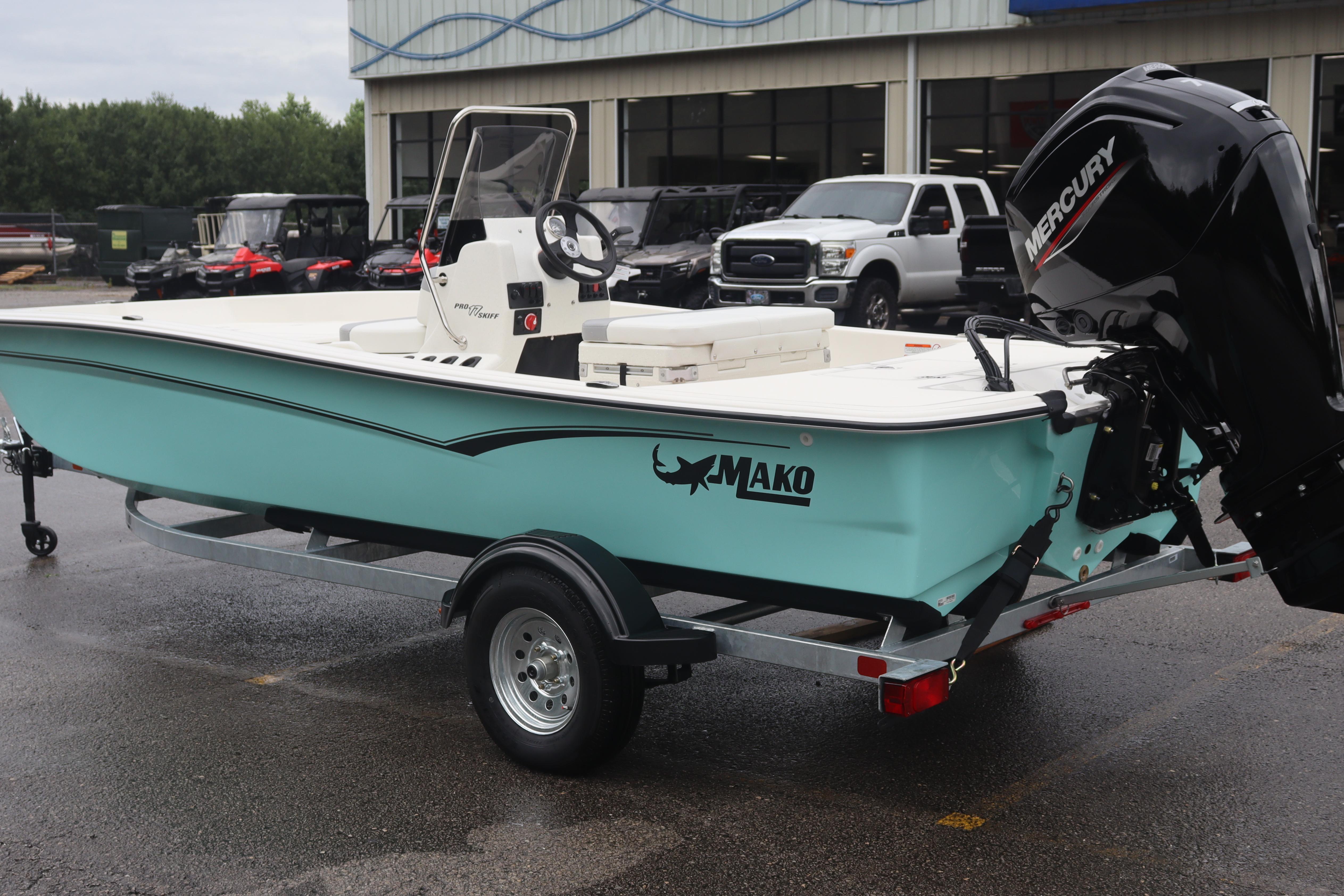 2026 Mako Pro Skiff 17 CC boat on trailer with Mercury outboard motor.