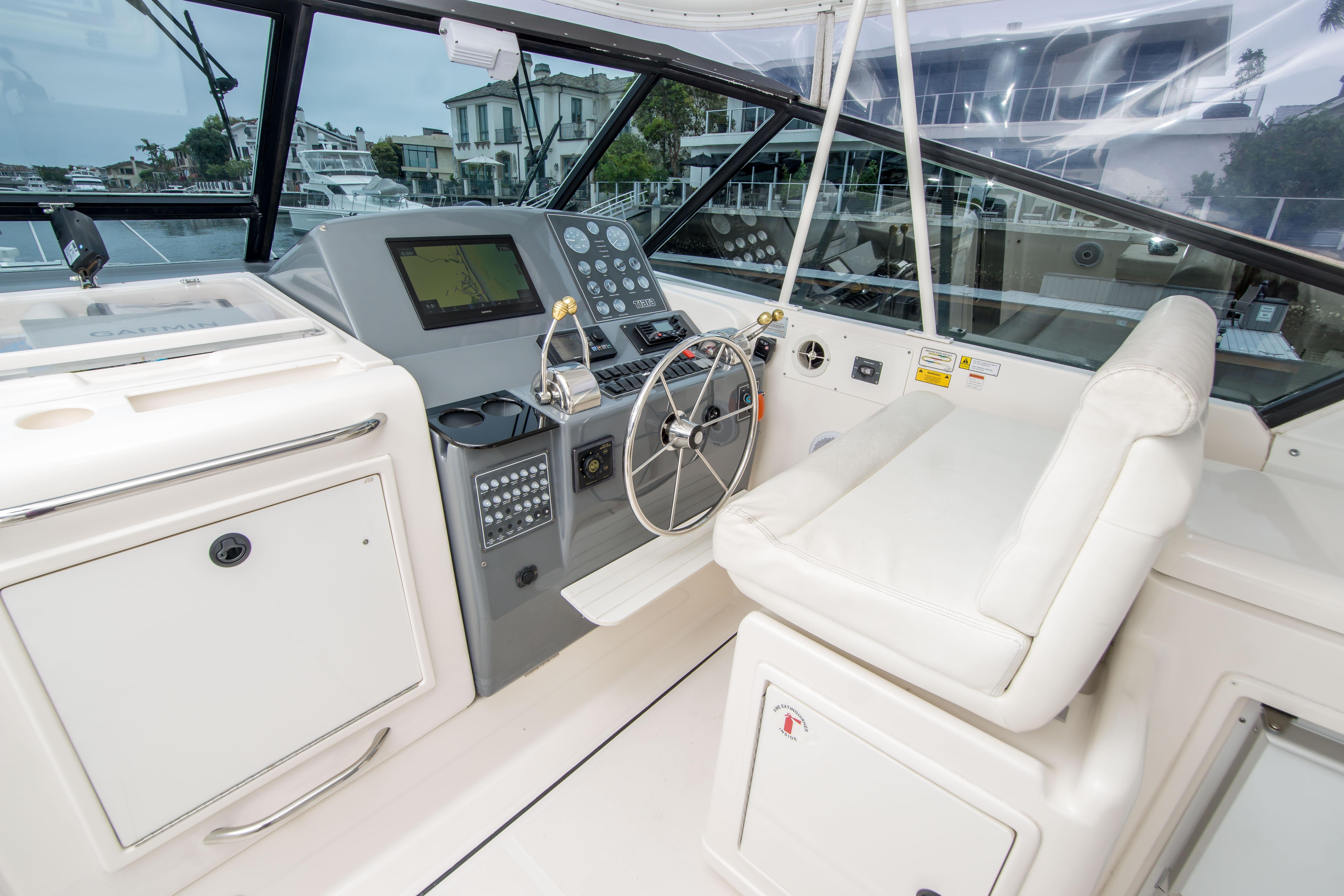 2002 Tiara Yachts 4100 Open helm with modern controls and comfortable seating.