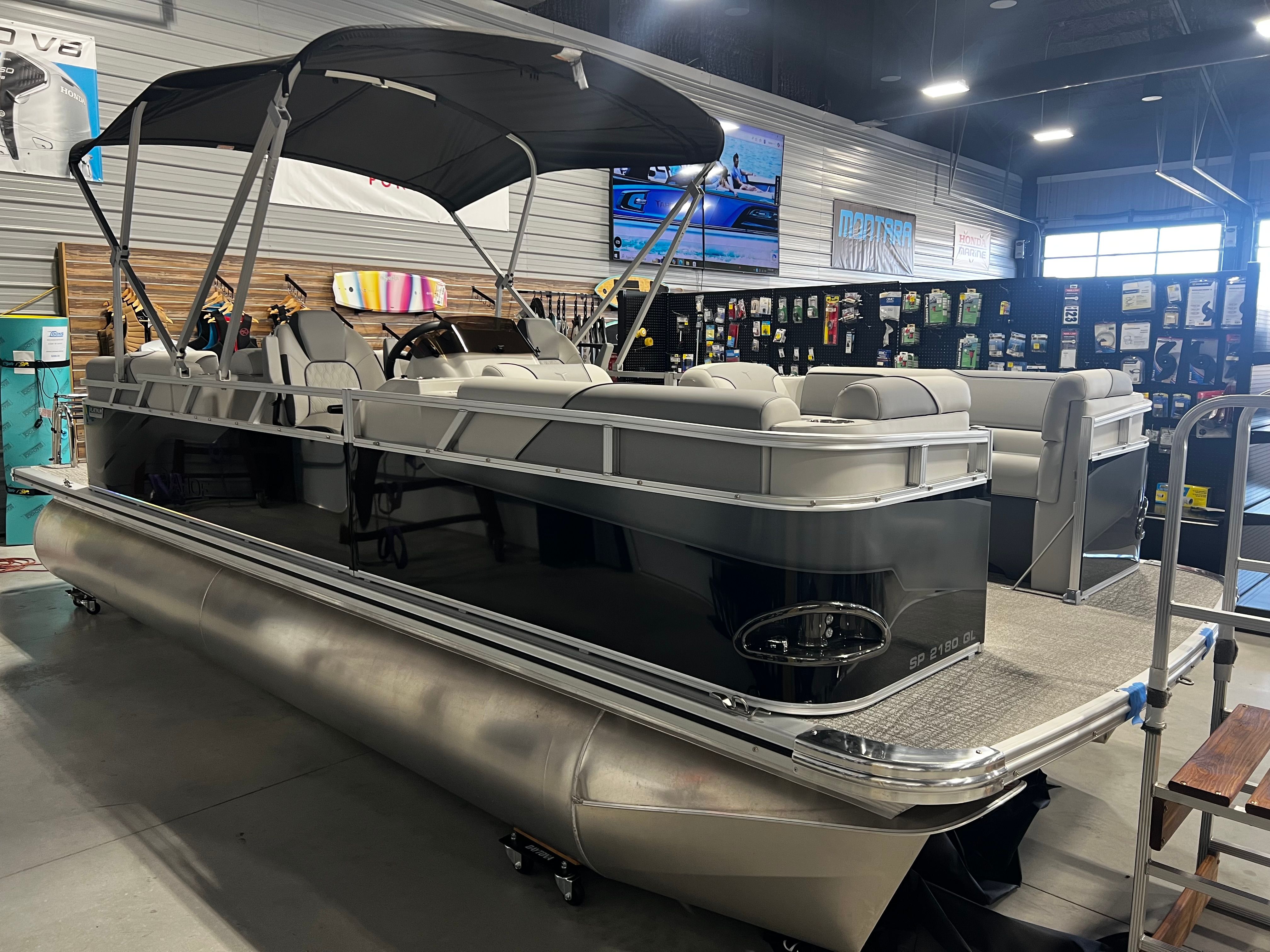 2026 Tahoe 2180 Sport Quad Lounger pontoon boat in showroom.