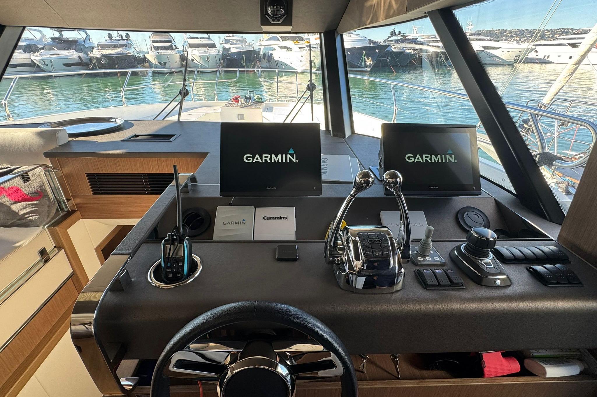 Cockpit of 2022 Prestige X60 yacht with Garmin navigation displays and controls.