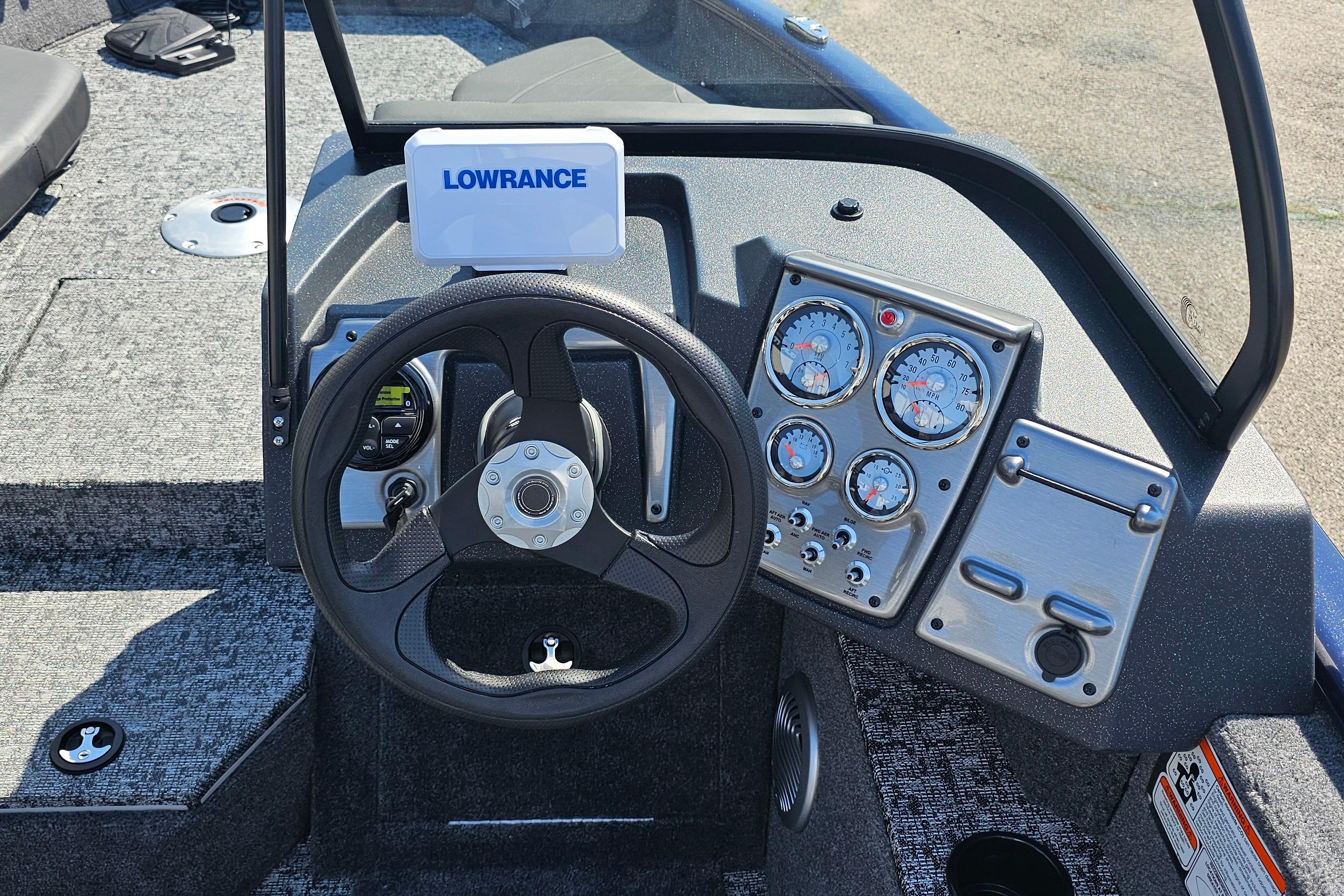 2026 Tracker Pro Guide V-175 Combo boat dashboard with Lowrance display and gauges.