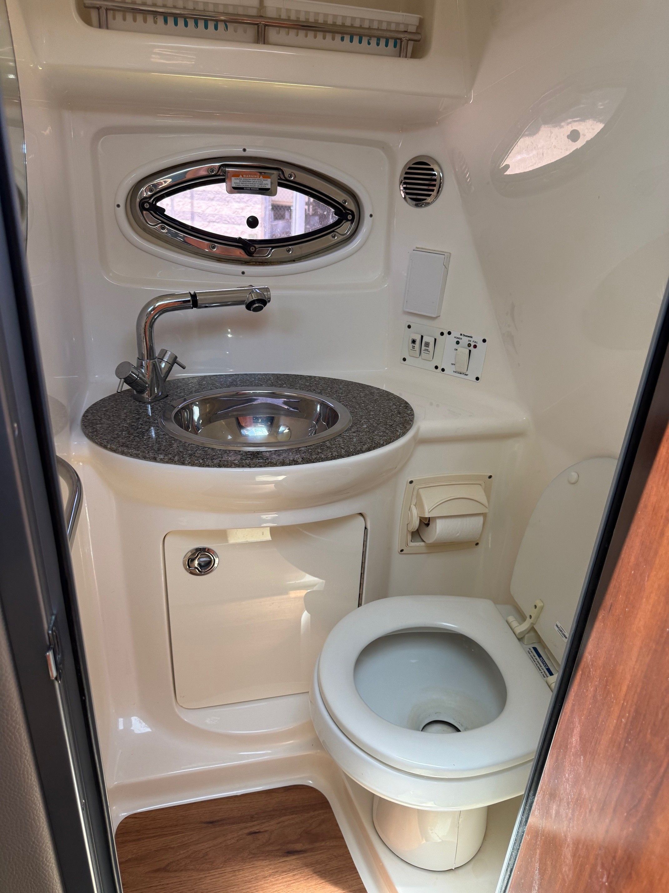 Interior of 2018 Chaparral 270 Signature with sink and toilet.
