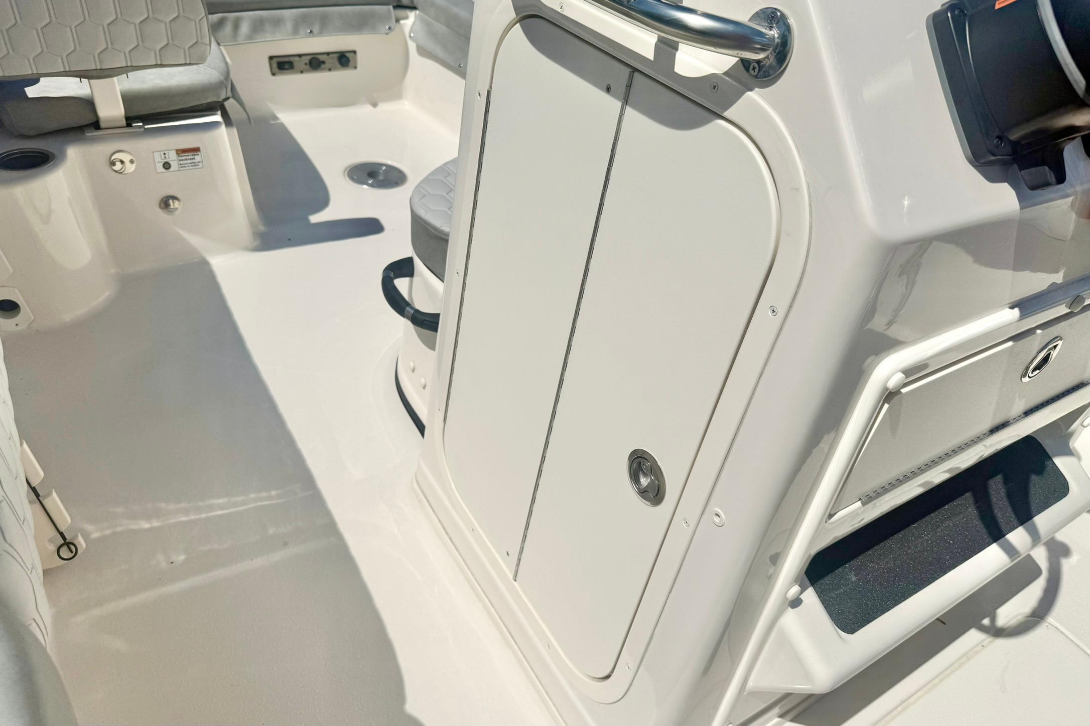 2026 Carolina Skiff 21 Ultra Elite boat interior with seating and storage compartments.