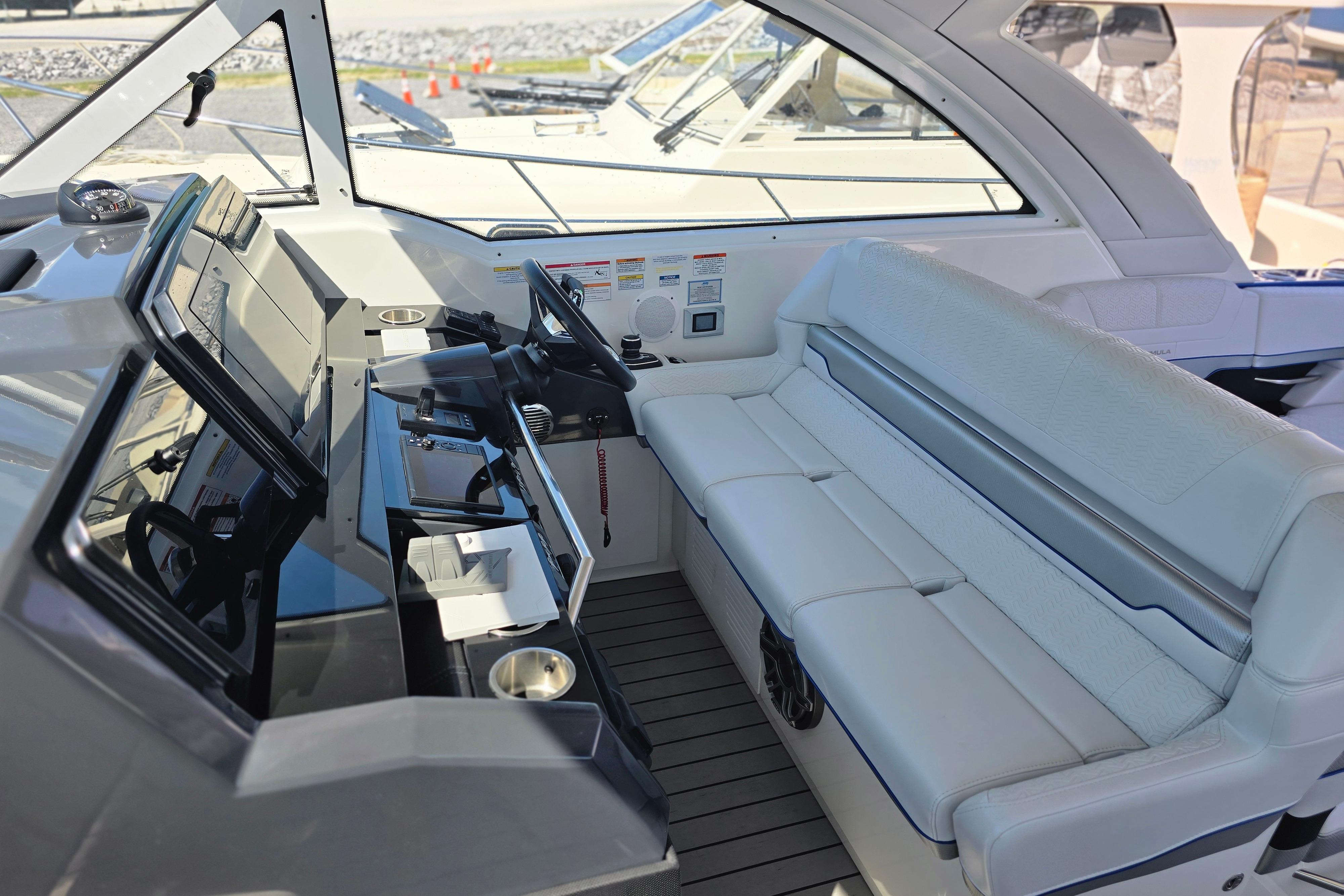 2025 Formula 380 Super Sport Crossover OB cockpit with modern controls and luxurious seating.
