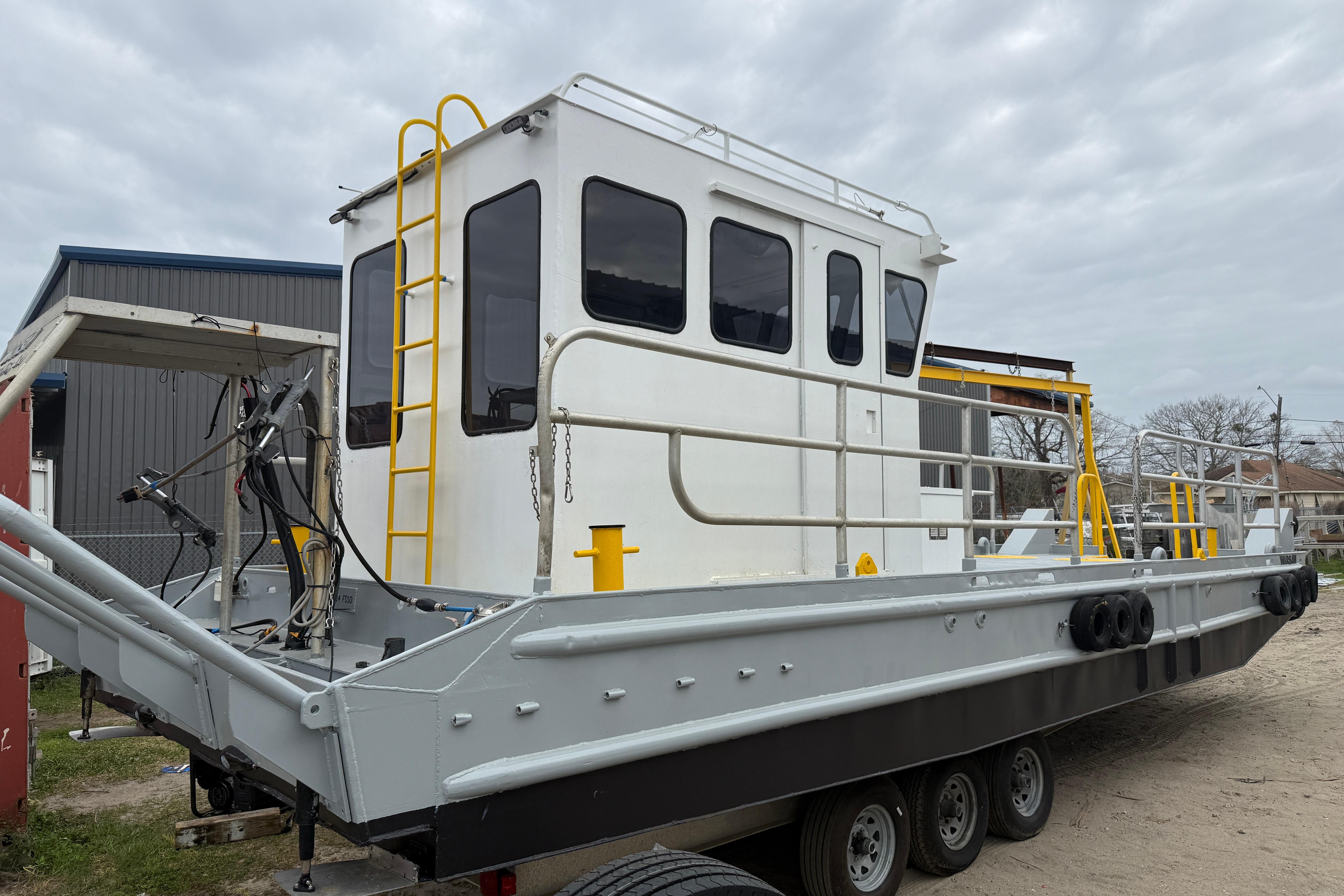 Custom Aluminum Work Boat 34x10, 2010 model, docked with visible equipment and safety features.