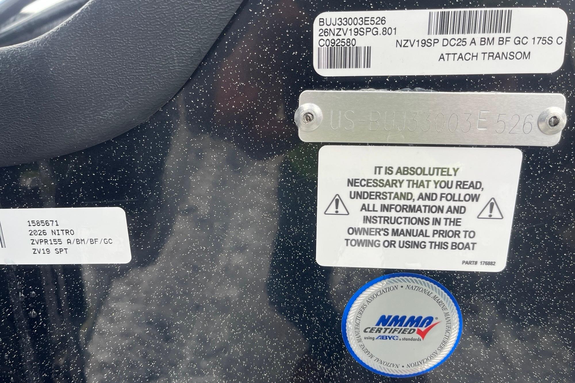 2026 Nitro ZV19 Sport Pro boat labels and certification stickers on speckled surface.