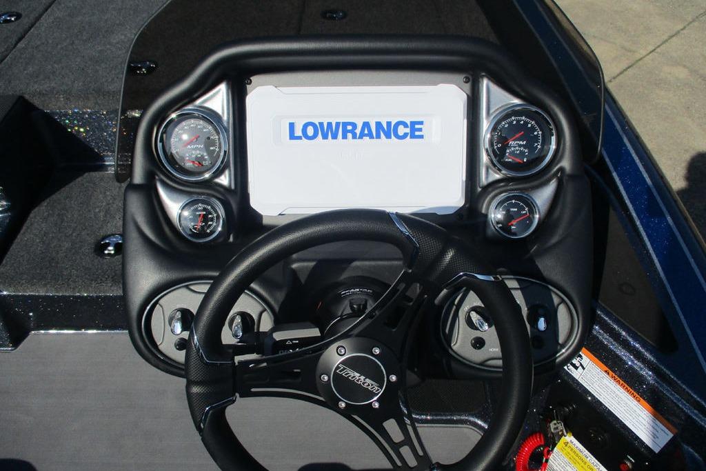 2026 Triton 18 TrX boat dashboard with Lowrance display and gauges.