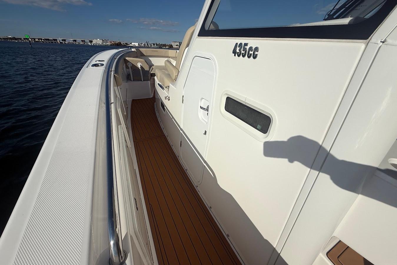 2020 Everglades 435 Center Console boat on water, showcasing sleek design and deck details.