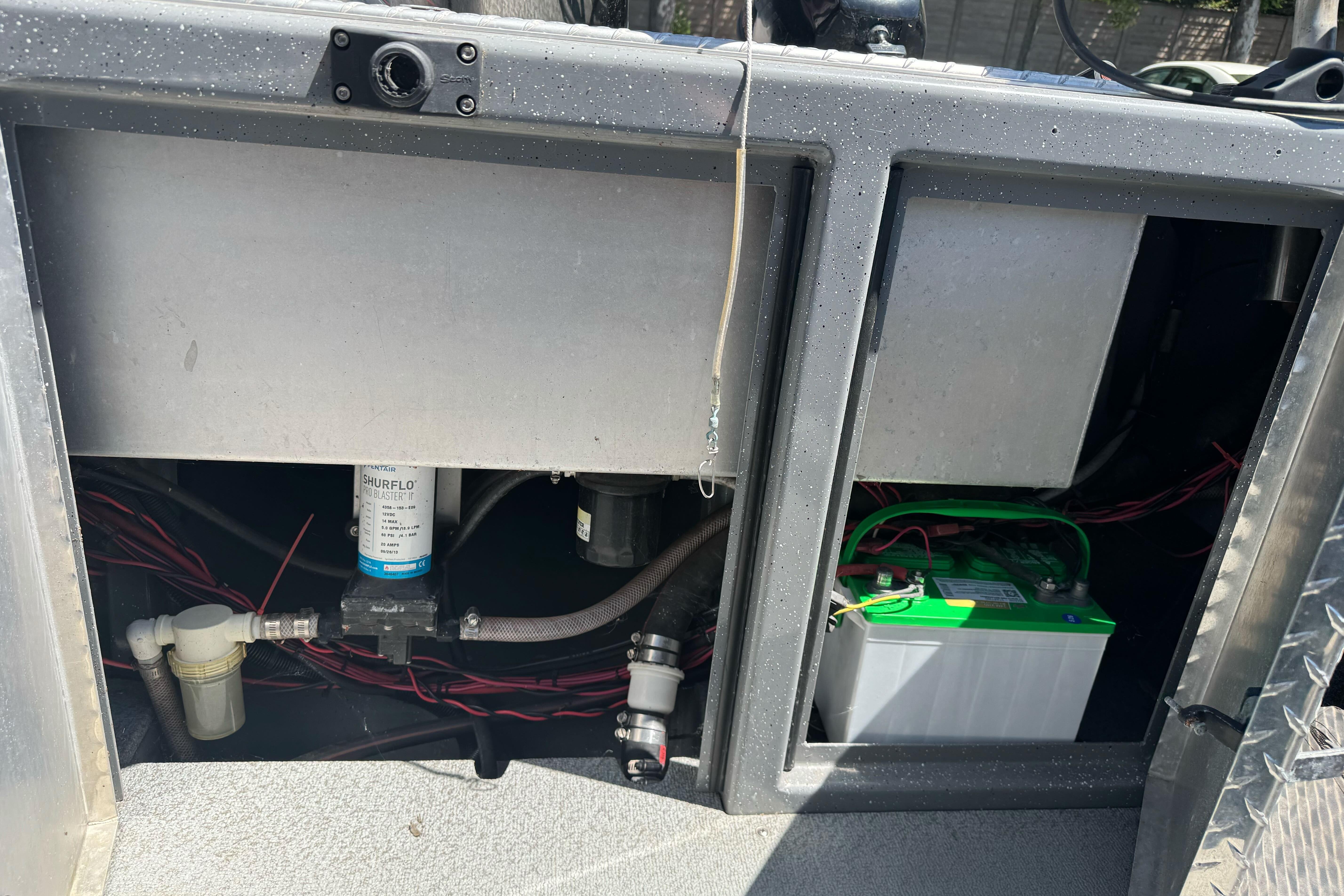 2014 River Hawk 19 GB boat compartment with battery and wiring.