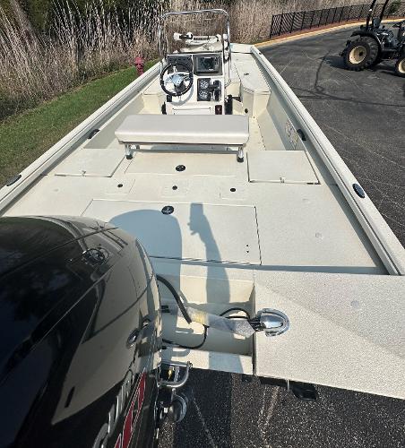 2024 Ranger RB200 boat with outboard motor, parked on pavement.