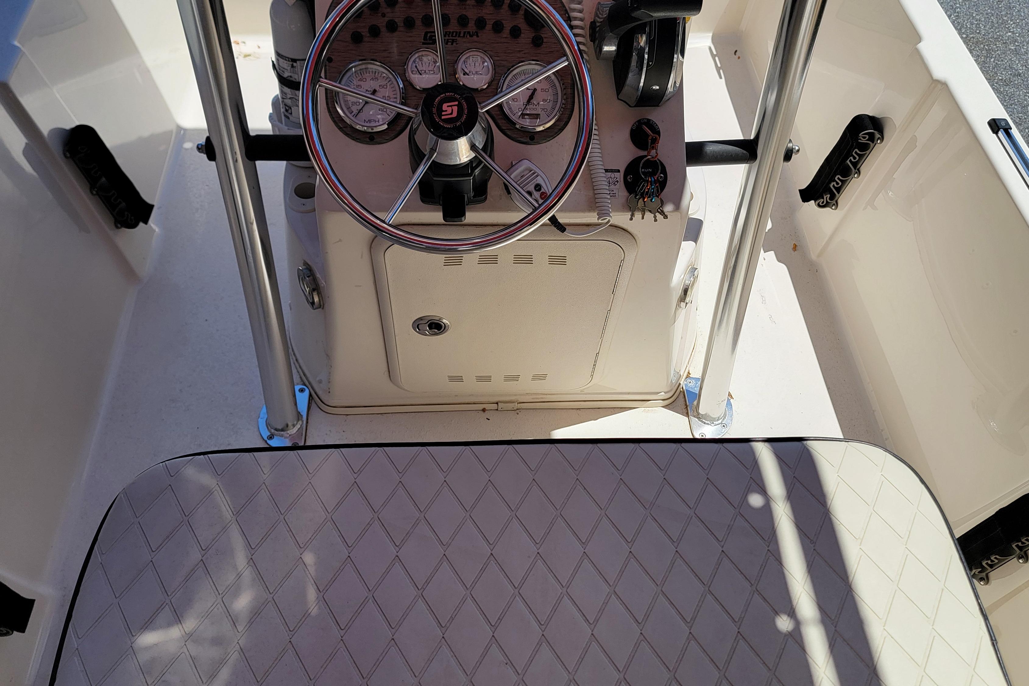 2021 Carolina Skiff 178 JLS boat console with steering wheel and gauges.