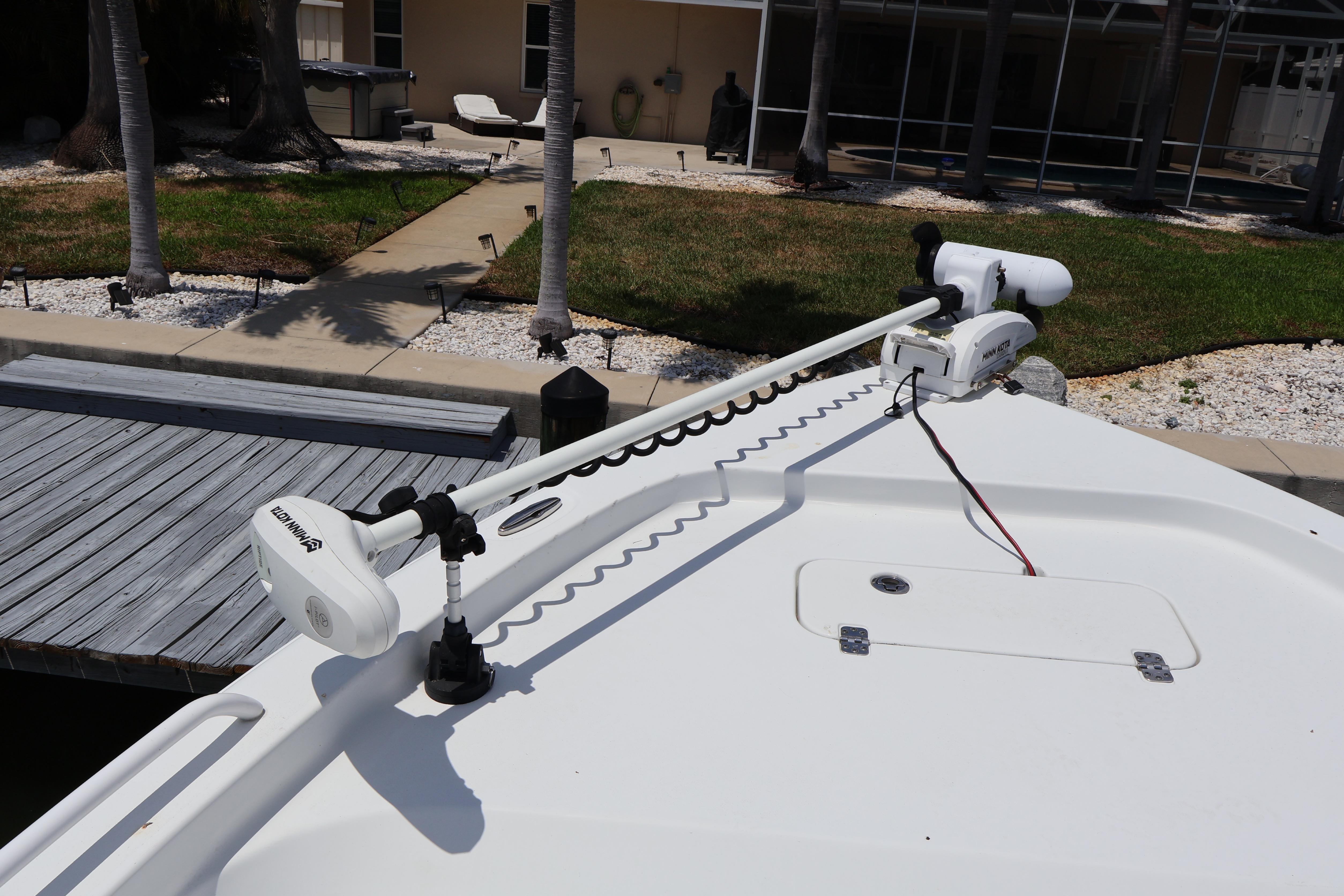 2022 Sea Hunt BX 25 FS boat with Minn Kota trolling motor at dockside.