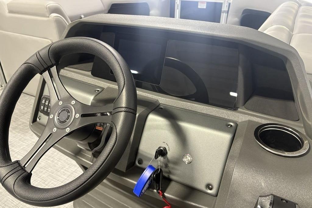 2026 Sun Tracker PARTY BARGE® 20 DLX dashboard with steering wheel and control panel.