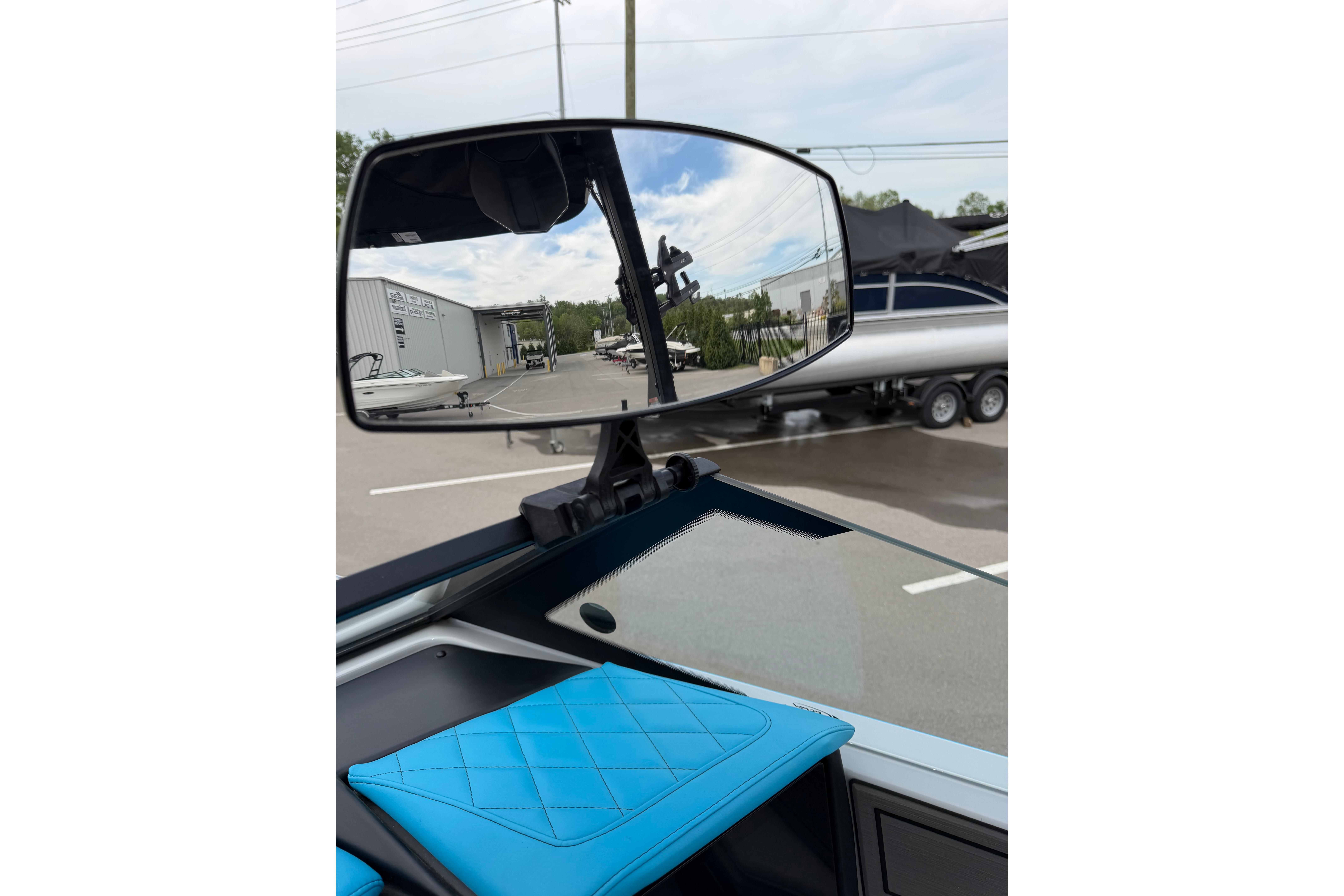 2024 Tigé Z1 boat interior with rearview mirror and blue seating.