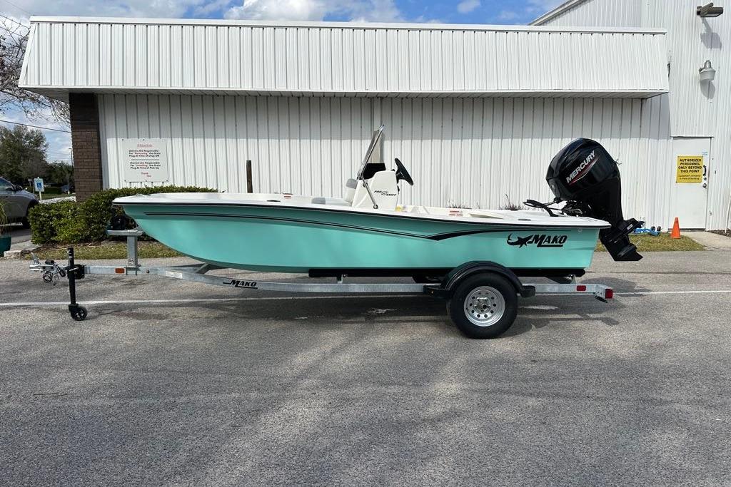 2026 Mako Pro Skiff 17 CC boat on trailer, parked outdoors.