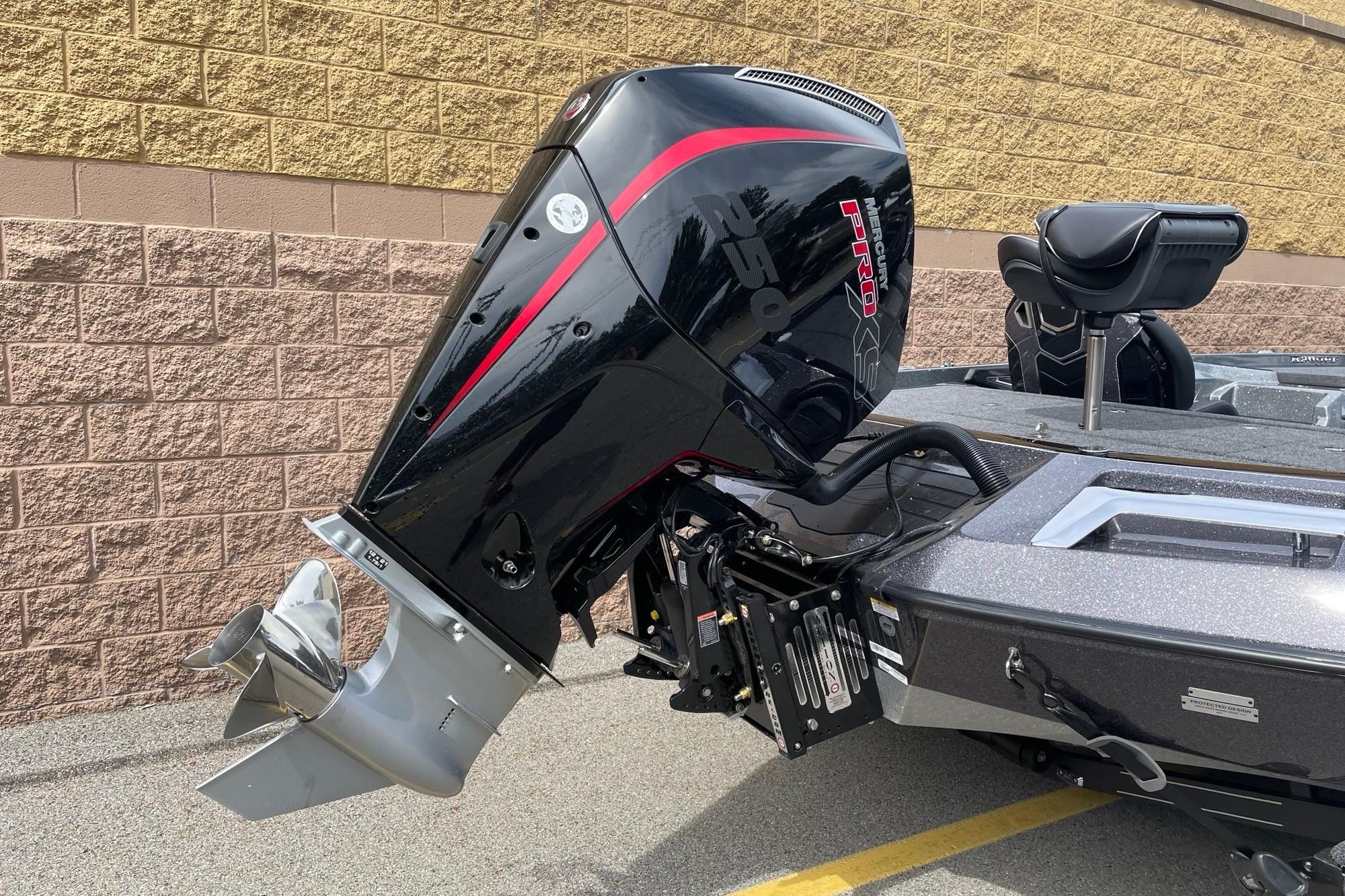 2026 Ranger Z520R boat with powerful outboard motor, parked on concrete surface.
