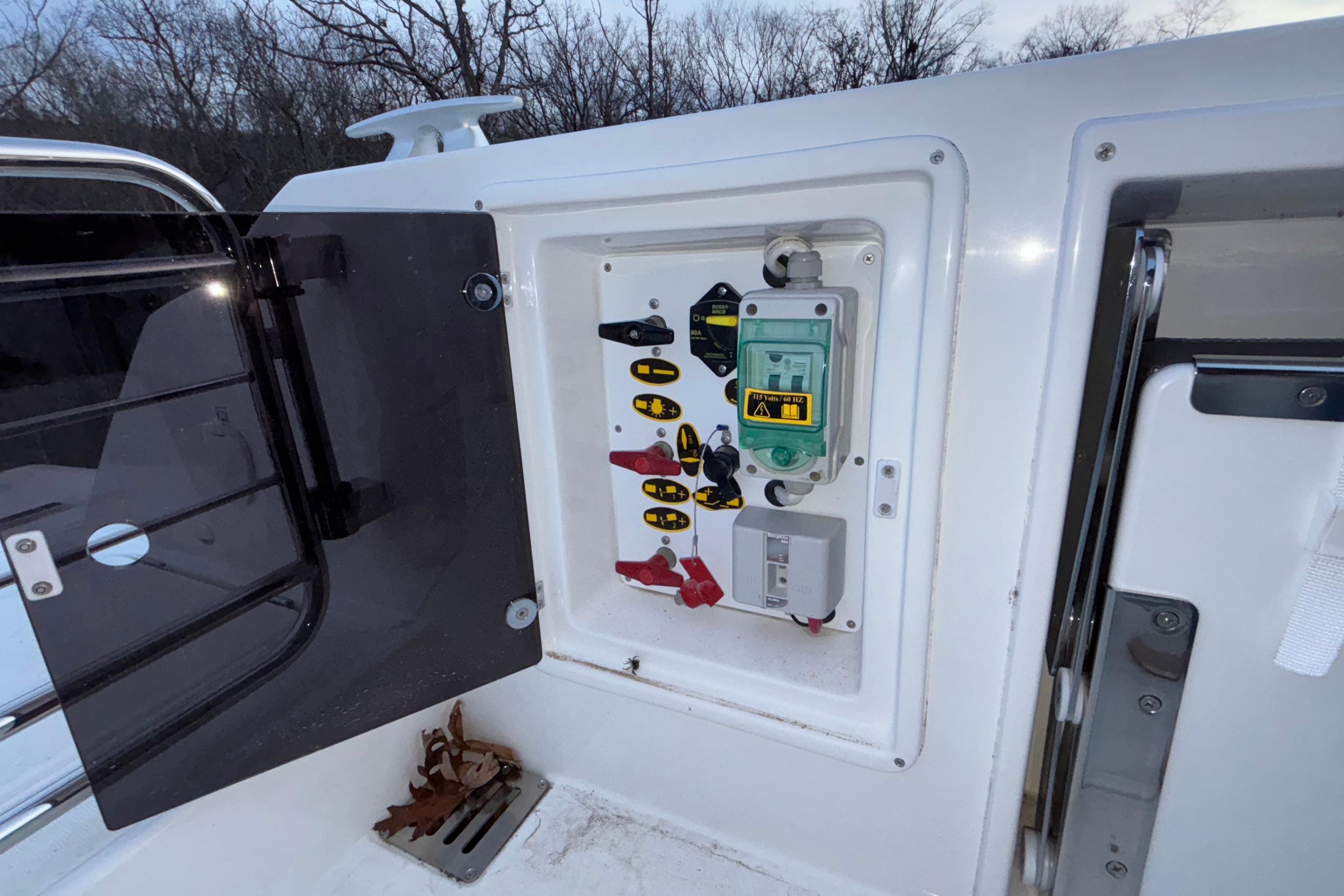 Electrical panel on a 2022 Jeanneau Leader 9.0 CC boat, open compartment view.