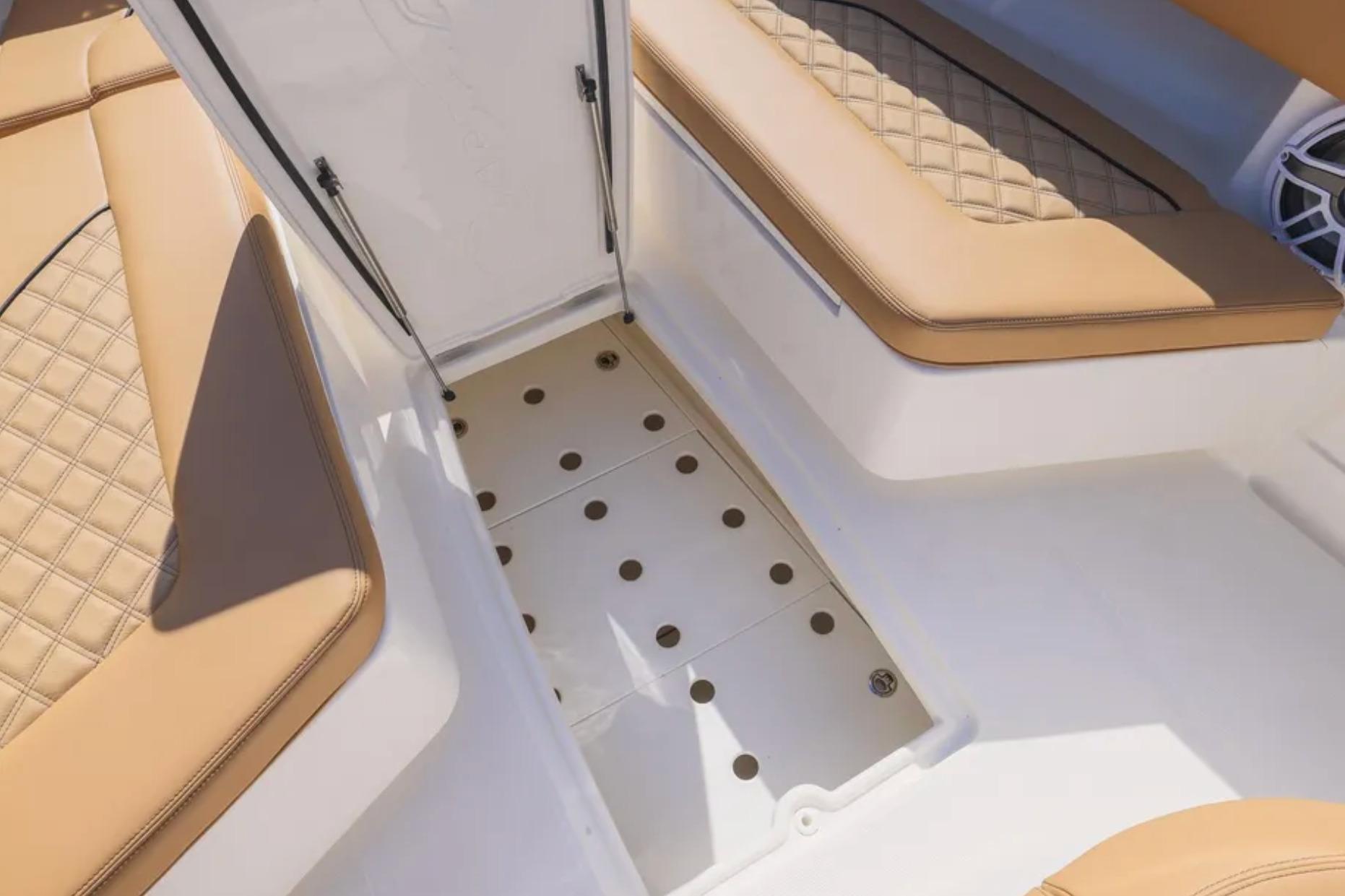 2025 Blackwater 41 Performance Fish boat interior with tan quilted seating and storage compartment.