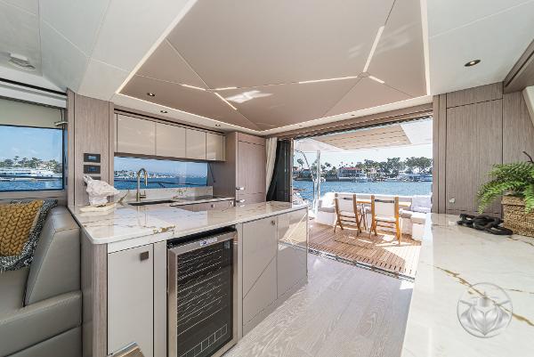 Luxurious Sunseeker Manhattan 68 yacht interior with modern kitchen and open deck, 2025 model.