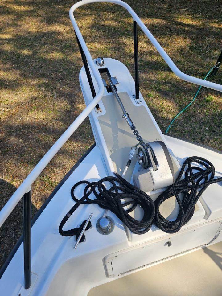 1991 Pro-Line Cuddy Cabin boat with anchor winch and rope.