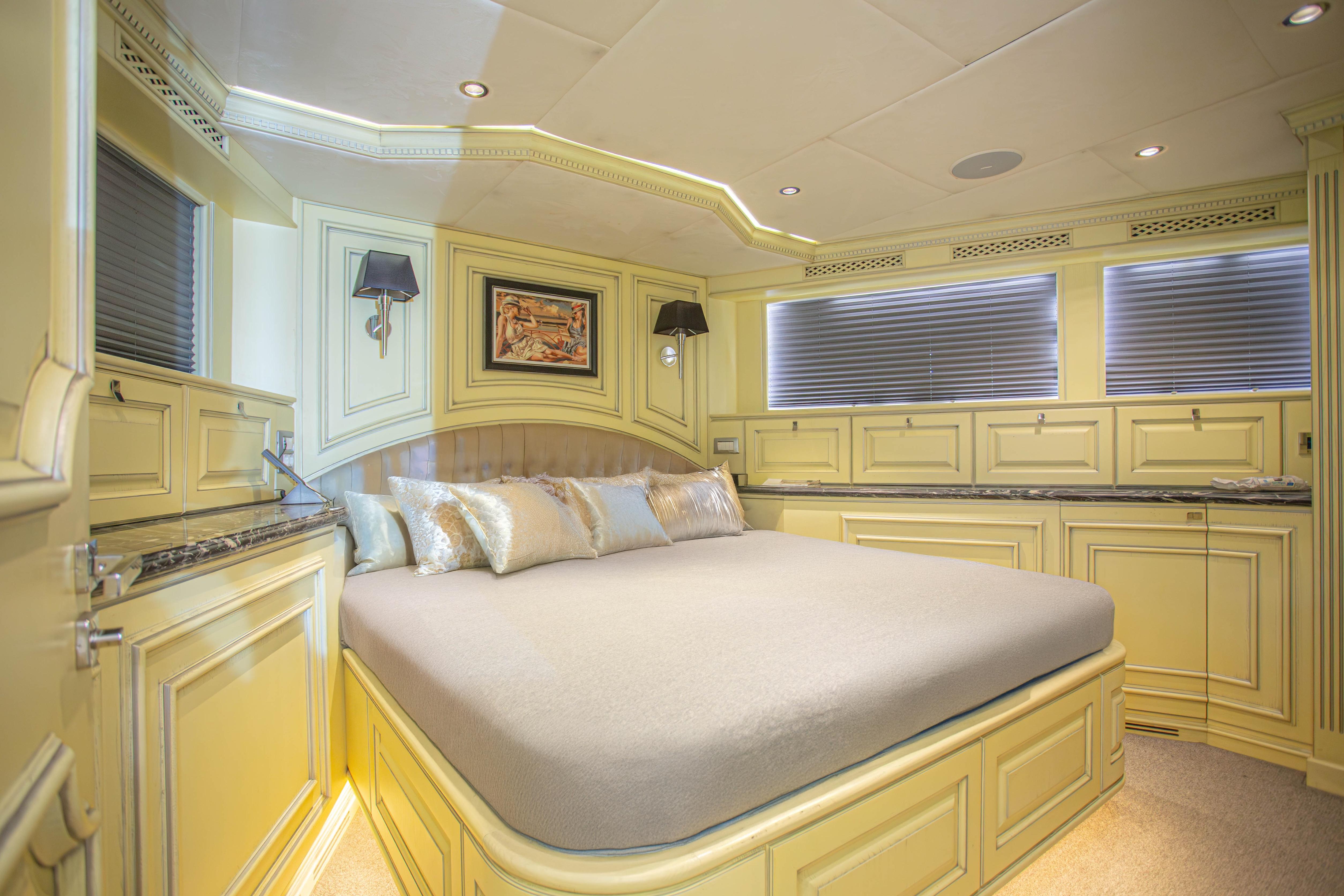 Luxurious bedroom interior of 2014 Fifth Ocean Yachts 24m Displacement Explorer Yacht.