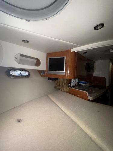 Interior of 2005 Four Winns 298 Vista boat with cozy cabin and modern amenities.