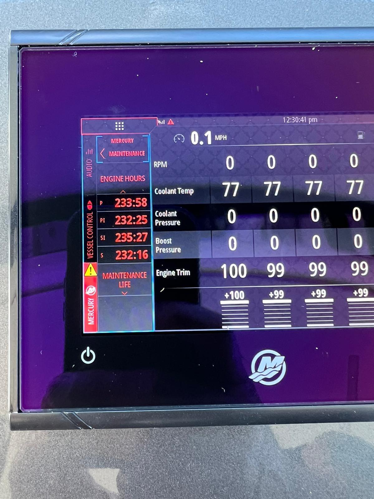 Digital dashboard of a 2020 Ocean Alexander 45 Divergence boat displaying engine metrics.