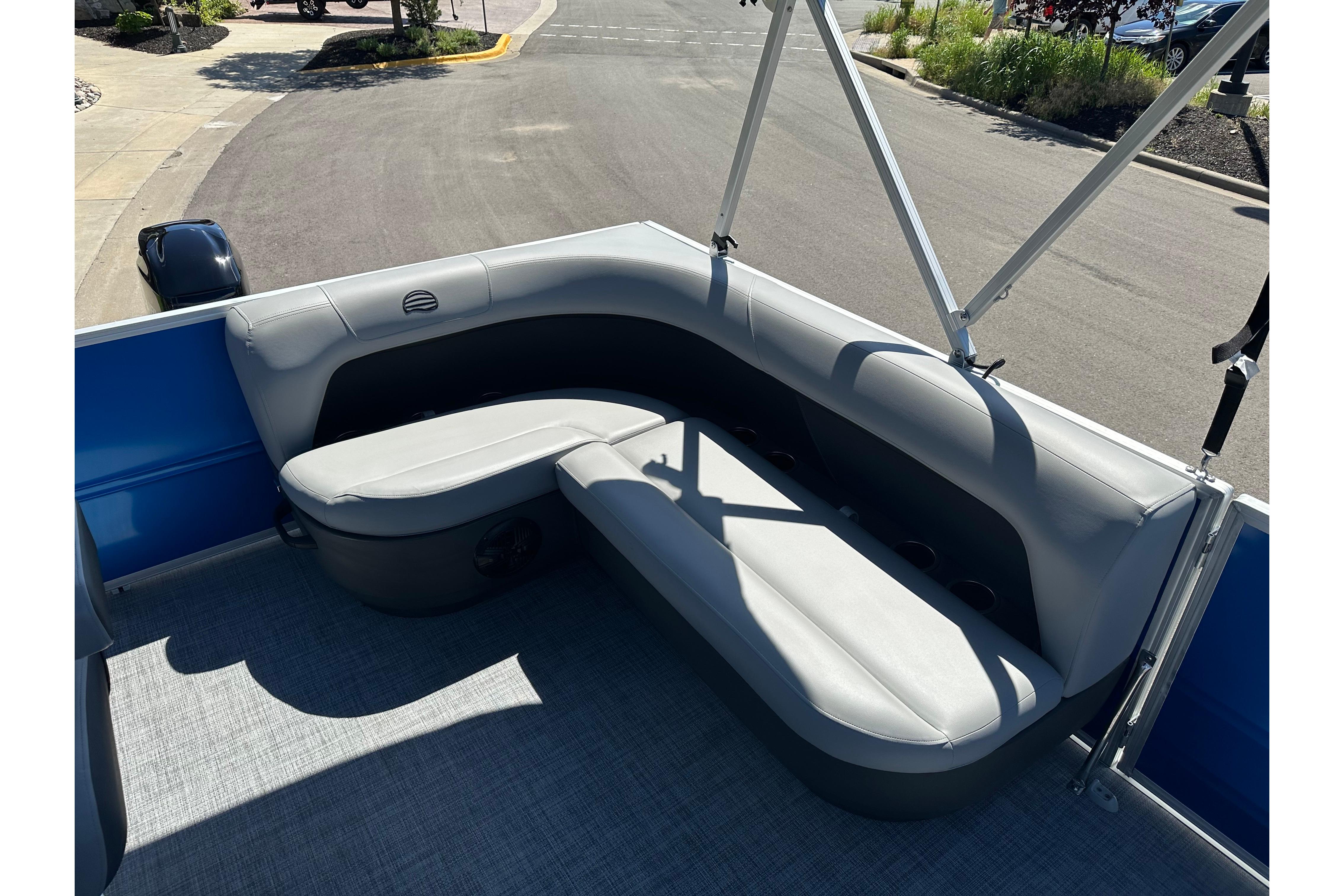 2026 Sun Tracker Party Barge 16 DLX with gray seating and blue exterior.